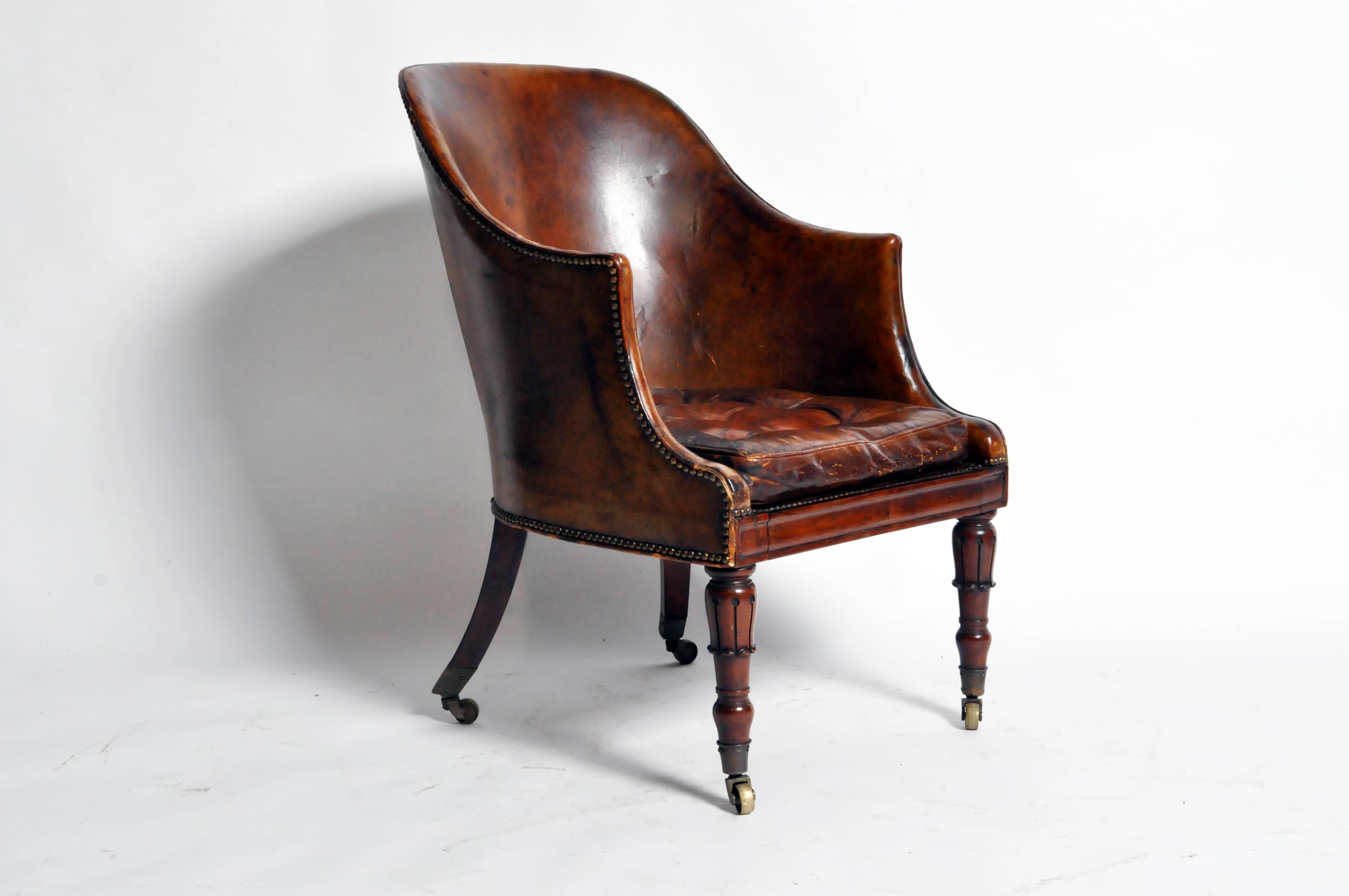 This handsome Napoleon III round back leather chair is from Paris, France and was made from leather and brass, c. 1880. The chair features a beautifully aged patina and its original brass casters.

Additional dimensions: 18