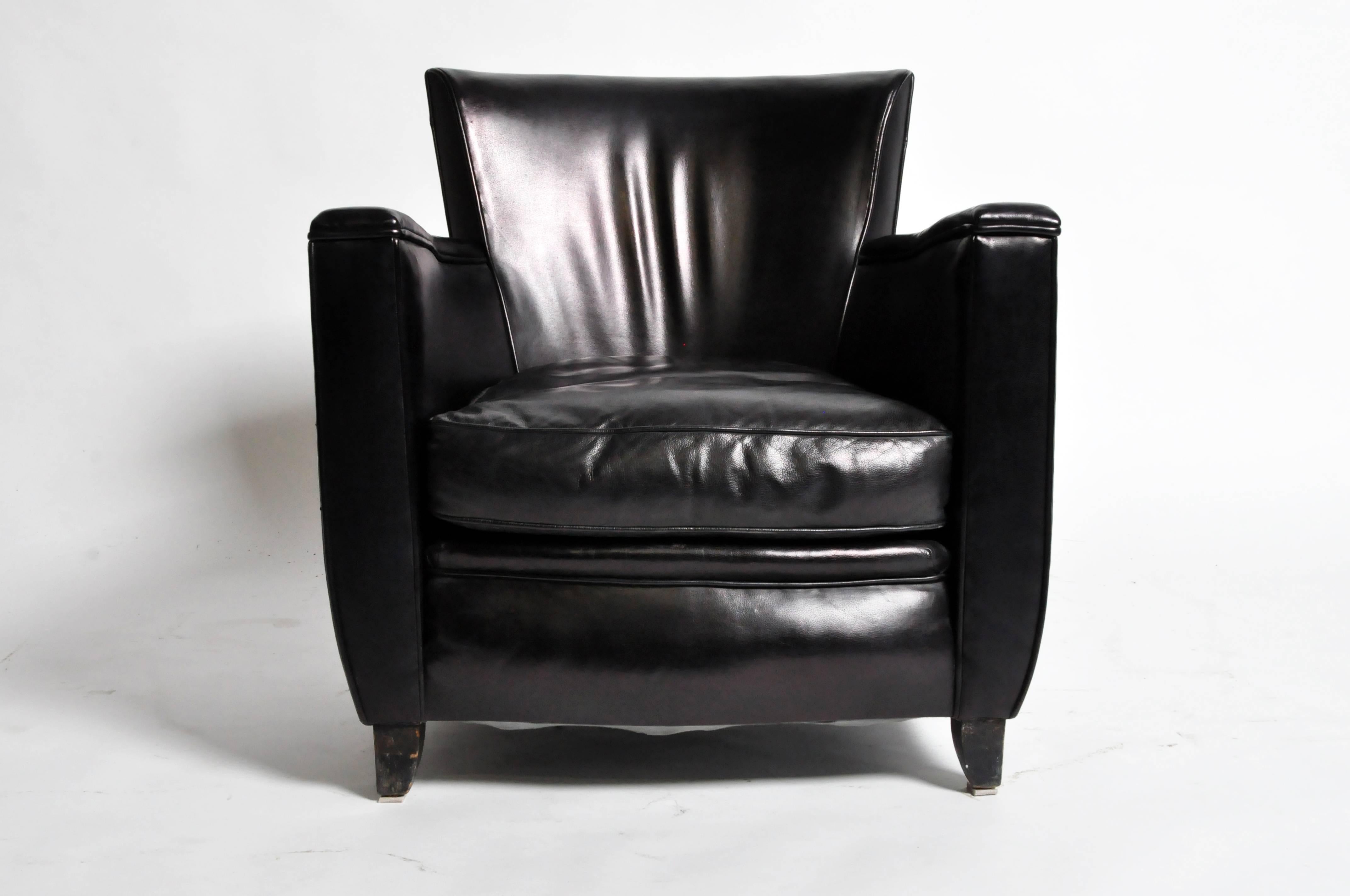 This pair of French Art Deco style armchairs are from Paris, France and was made from leather, c. 1960. The chairs features its original leather and a beautifully aged patina. 

Additional Dimensions: 19.5