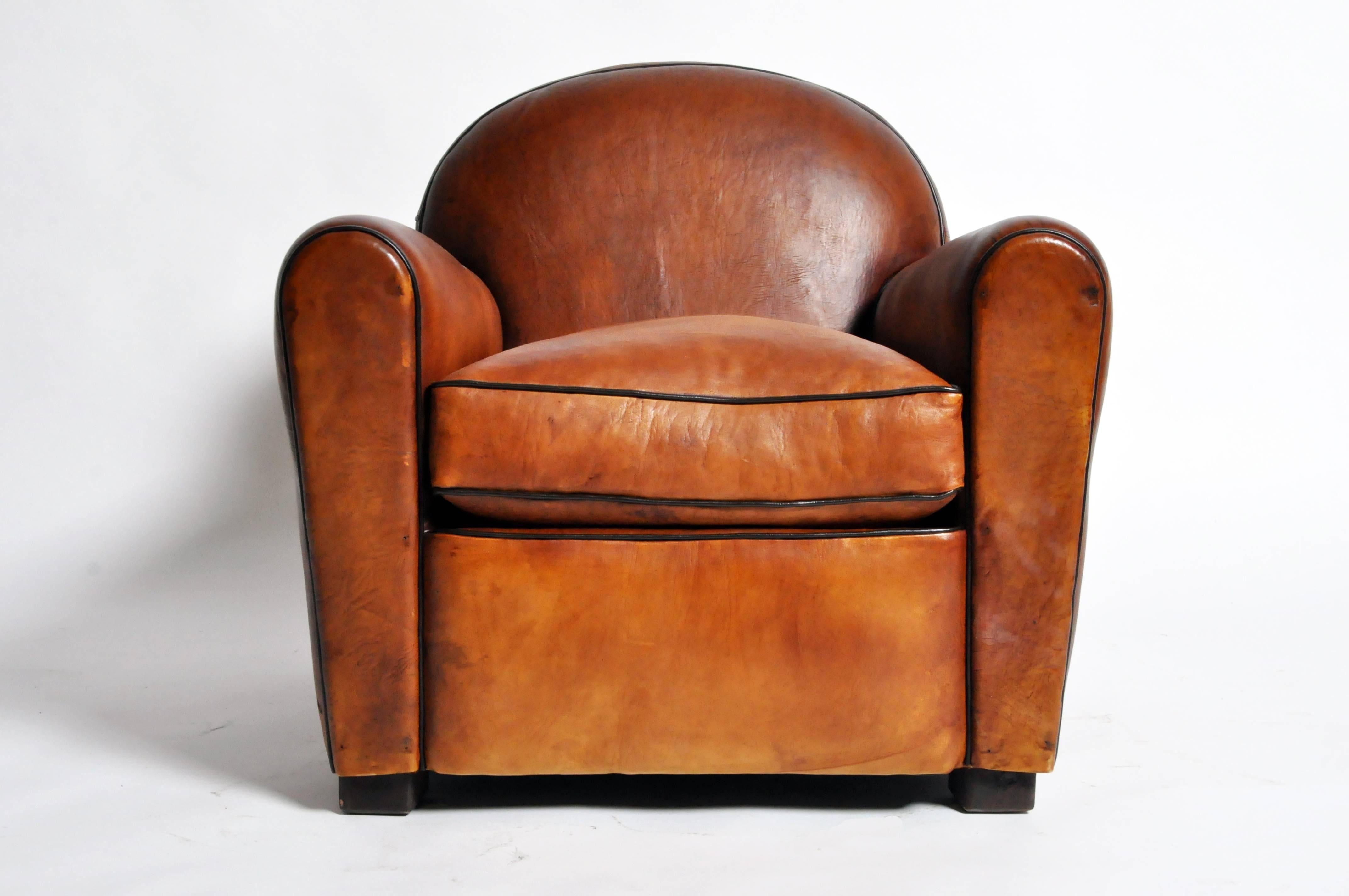 This handsome pair of newly made Parisian golden brown club chairs are from Paris, France and was made from lamb leather. They feature dark brown piping and are very comfortable.

Additional Dimensions: 19
