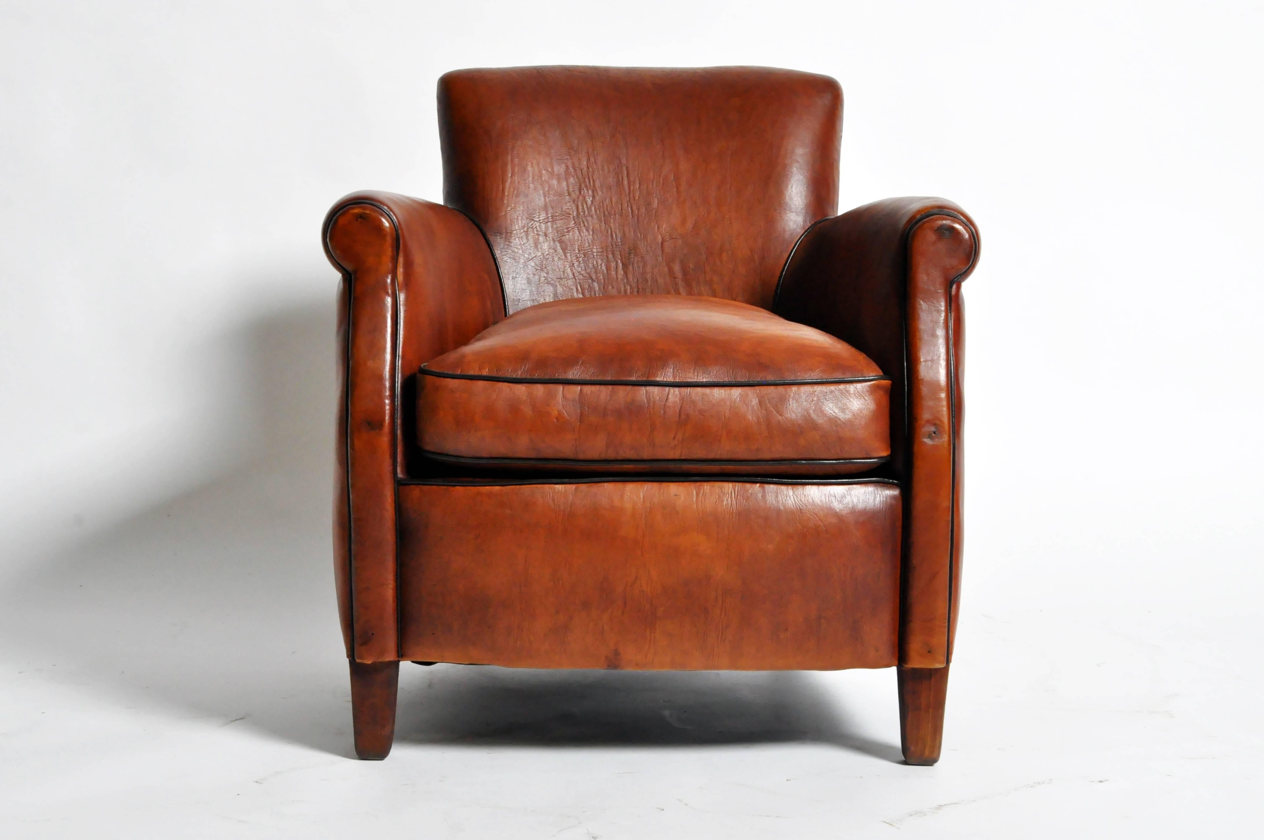This handsome pair of newly made Parisian golden brown club chairs are from Paris, France and was made from lamb leather. They feature dark brown piping.

Additional Dimensions: 18