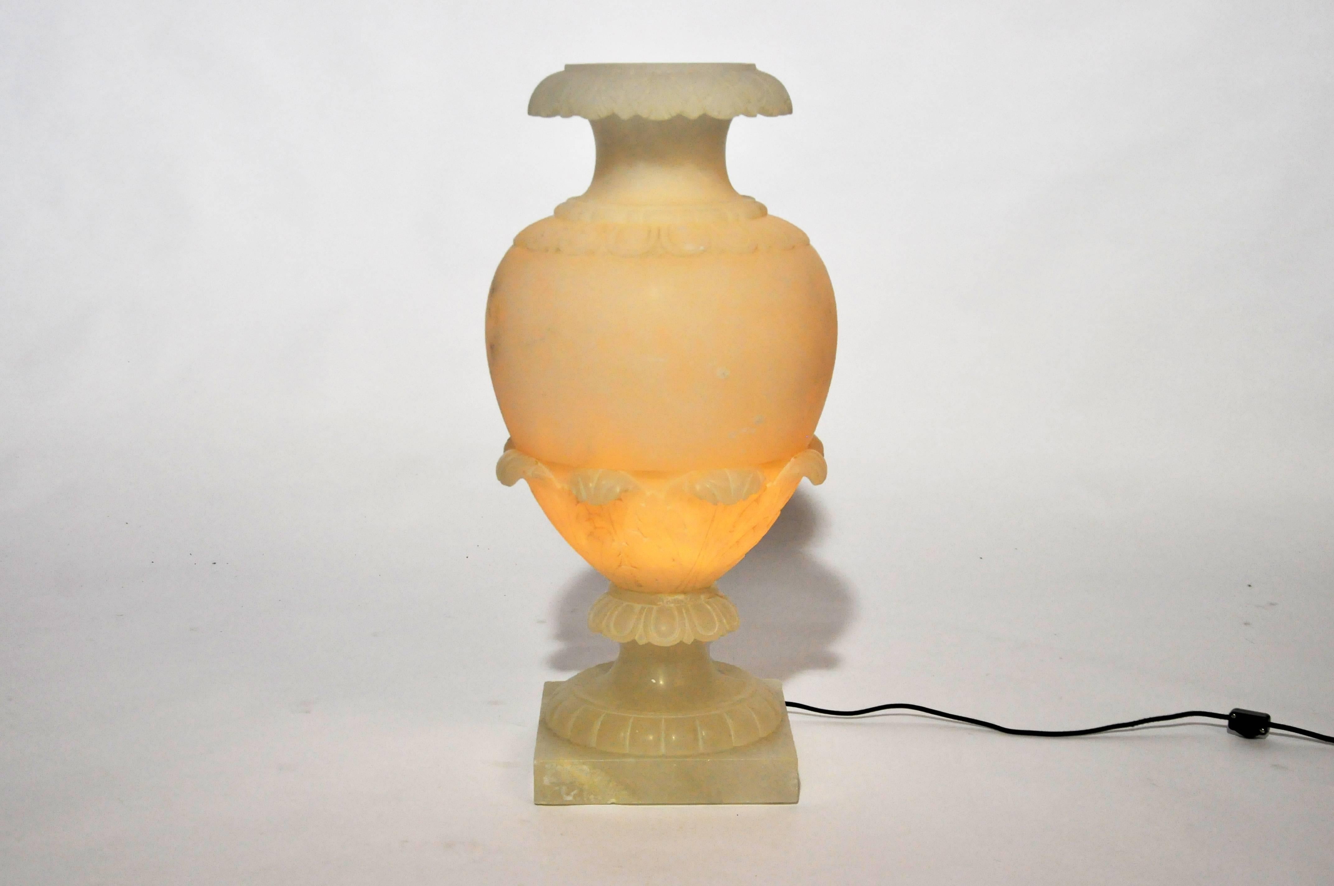 This alabaster jar lamp is from Paris, France, c. 1930. The lamp comes in two parts and has been rewired for use in the United States. 