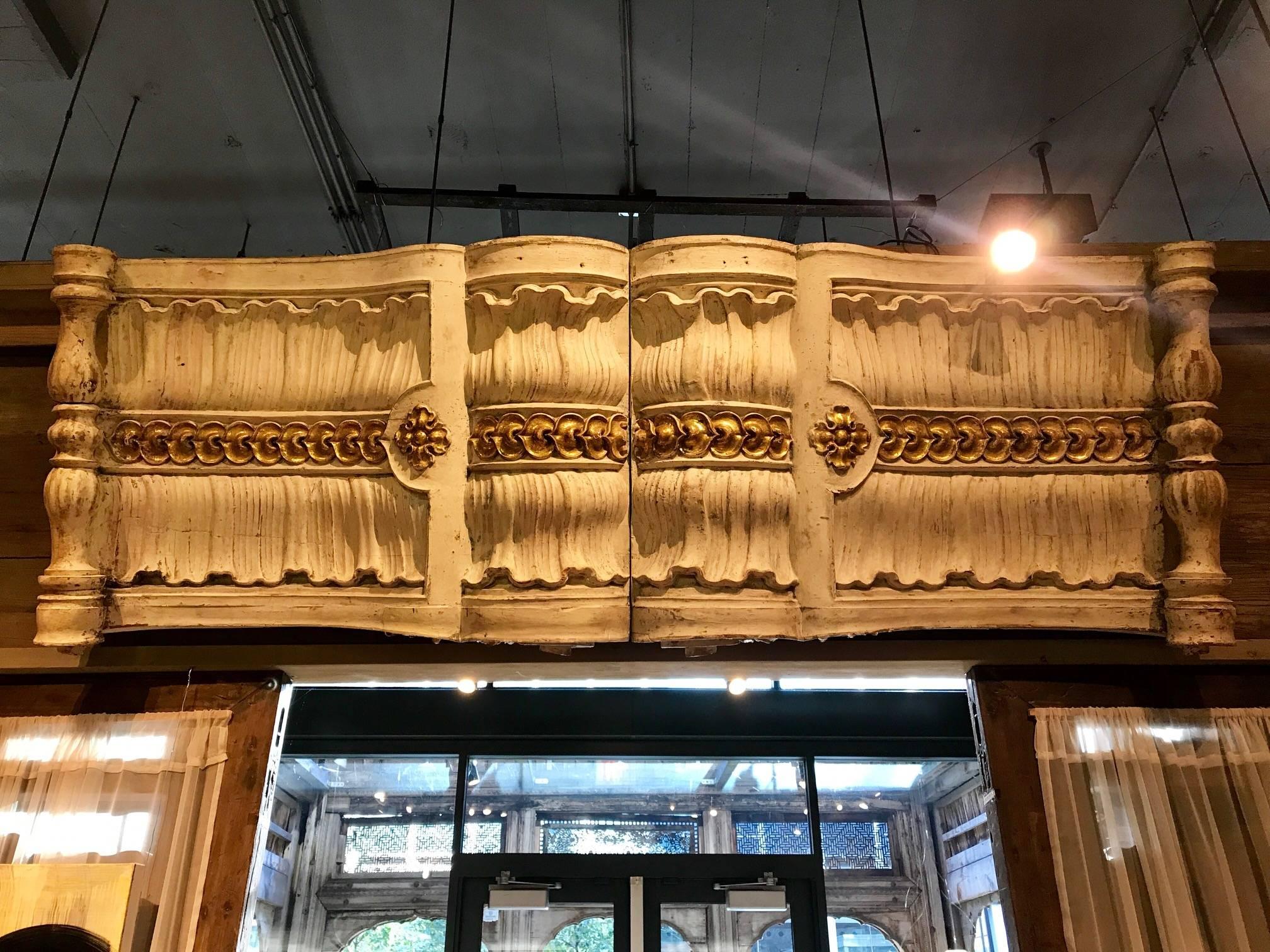 These painted architectural fragments are carved in an elegant classical style. They were salvaged from Chateau in Paris, France.