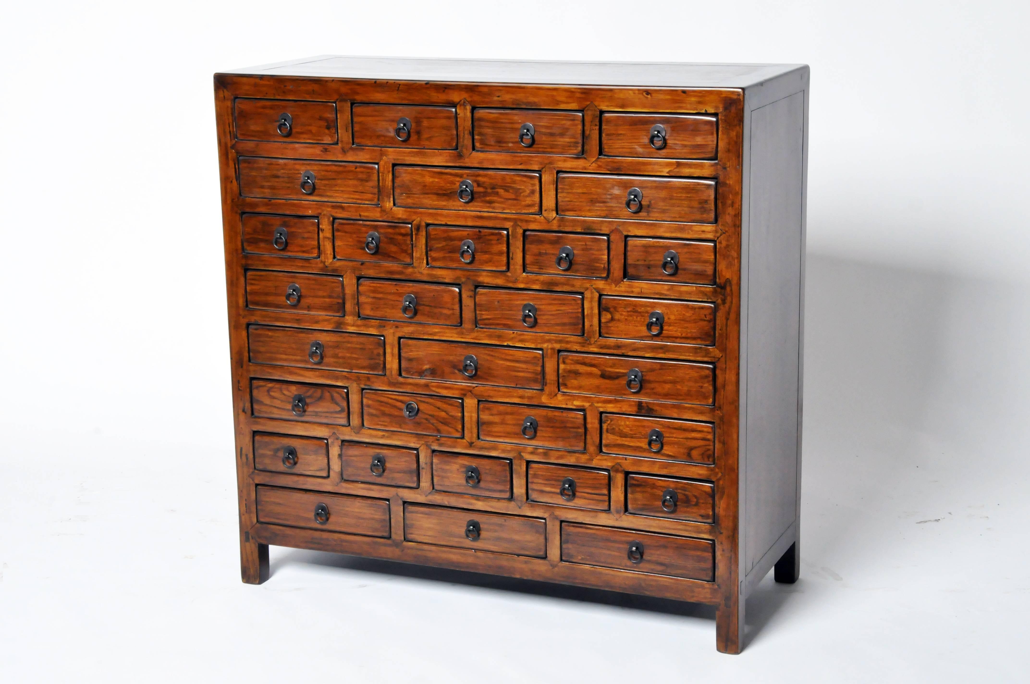 This letter cabinet was systematically designed to keep documents and writing implements such as paper, stationary, pens, brushes, inks, wax and seal presses organized. 31 drawers in three different sizes provide ample and efficient storage space.