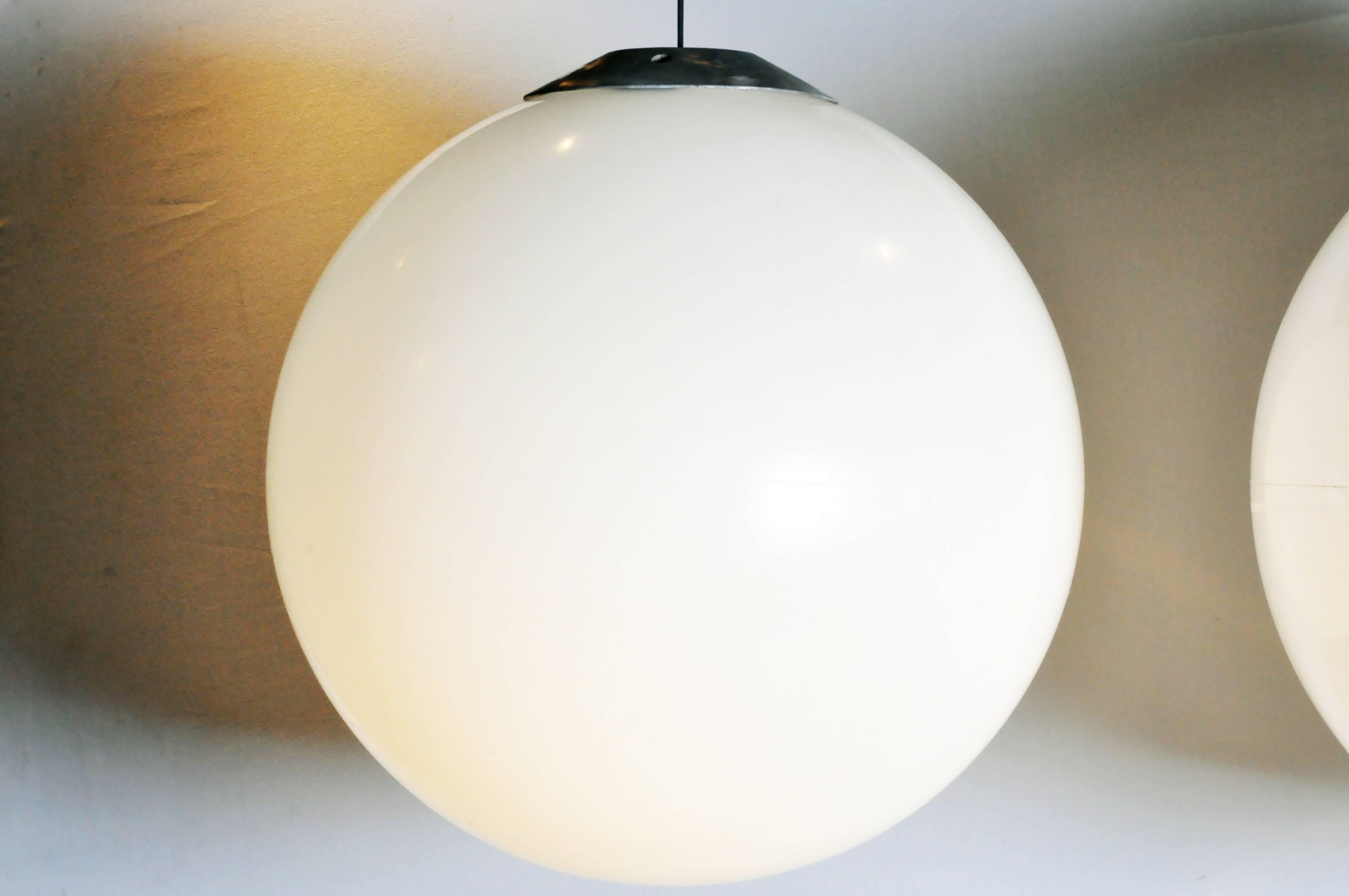 These large, opaque, resin globes hail from France and are suspended from black electrical cords.