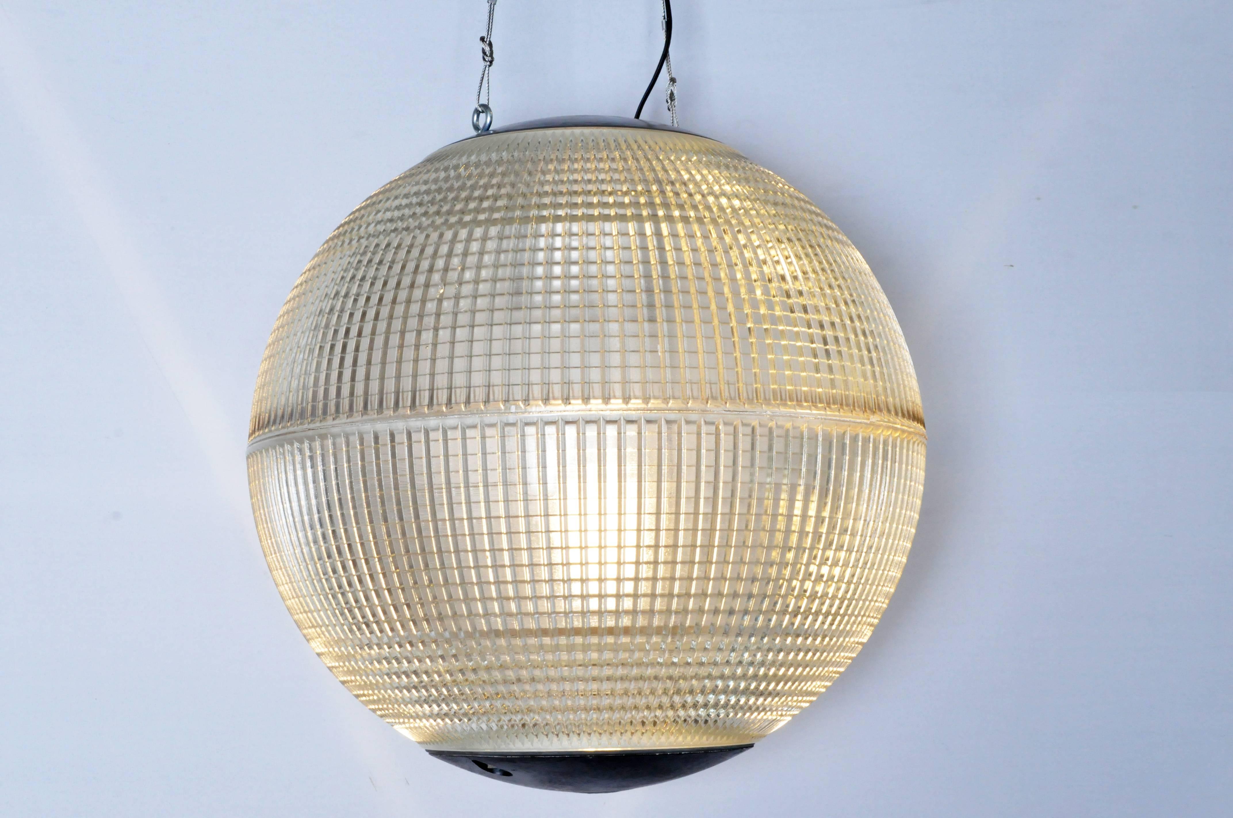 These iconic spheres once lighted the thoroughfares of Paris. Since being removed from their lampposts, these Industrial globes have been rewired for modern, indoor use. They display handsomely, making a statement individually as a table or floor