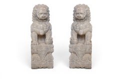 A Monumental Pair of Carved Limestone Fu Dogs