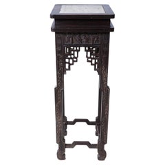 A Chinese Carved Wood Display Stand with Inset Stone Top