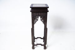 A Chinese Carved Wood Display Stand with Inset Stone Top