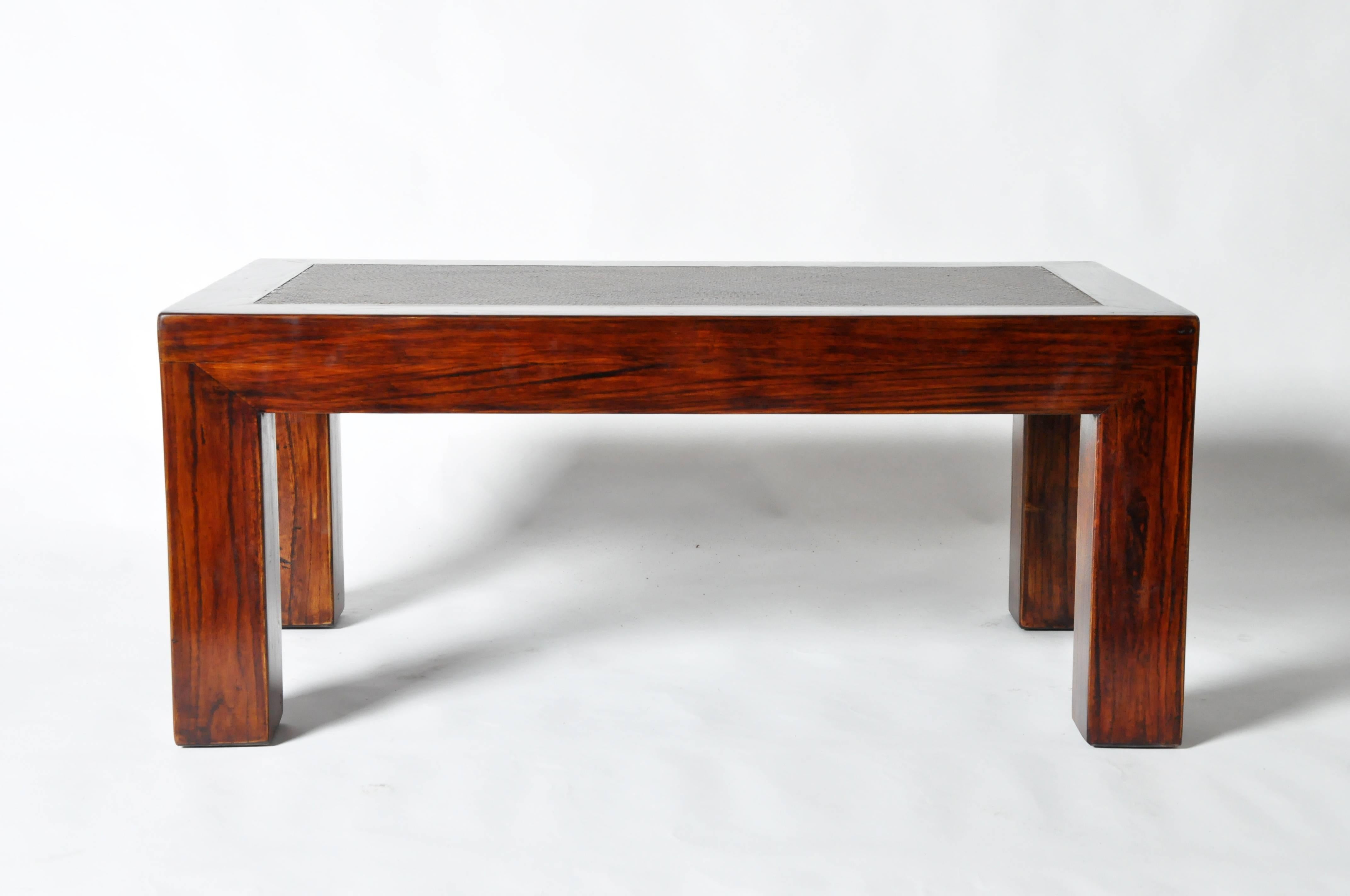 This Chinese low table is made from elmwood and has been fully restored.