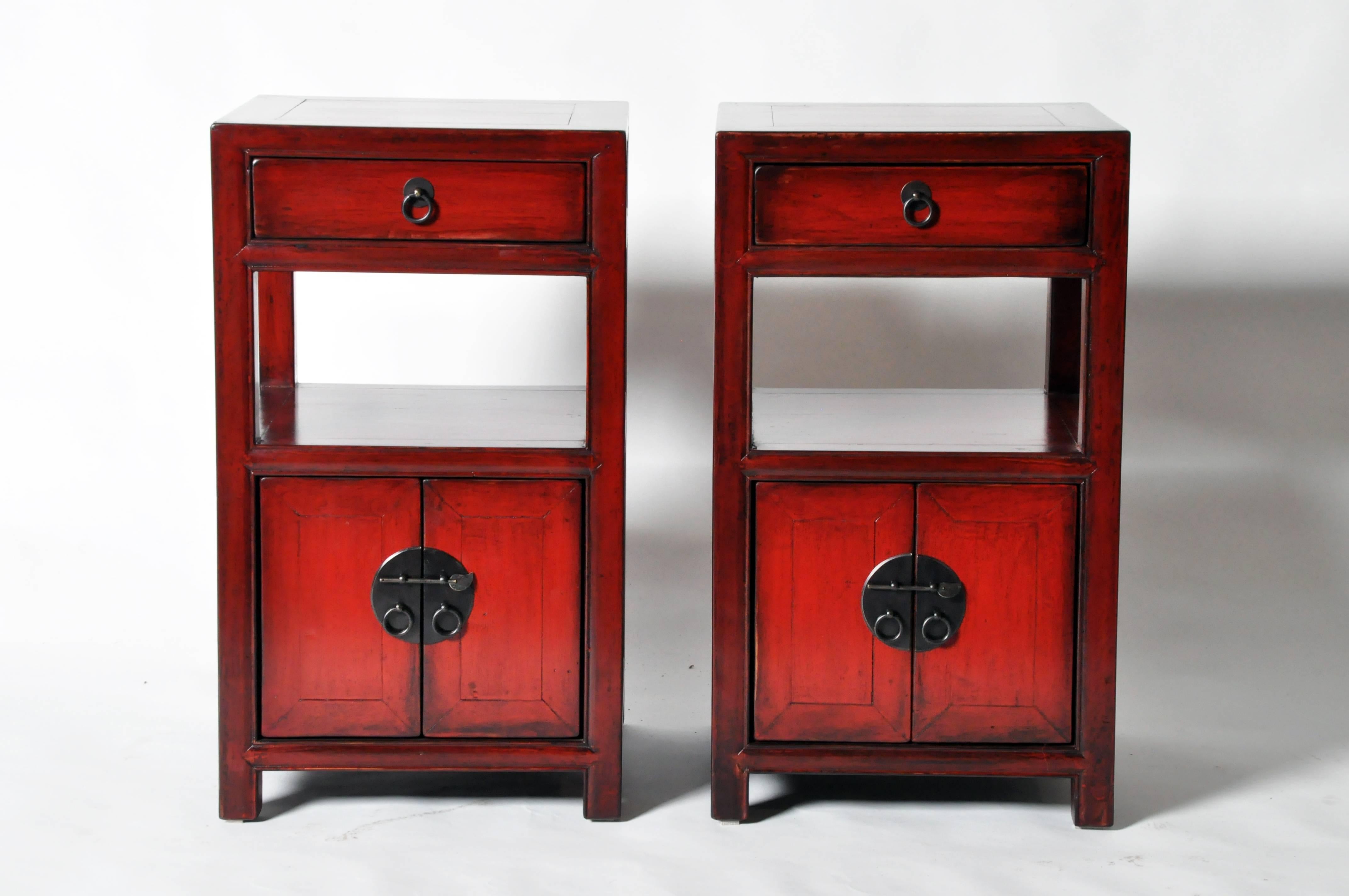 This pair of Chinese bedside chests is made from elmwood and has been fully restored. They each feature a drawer and bottom storage.