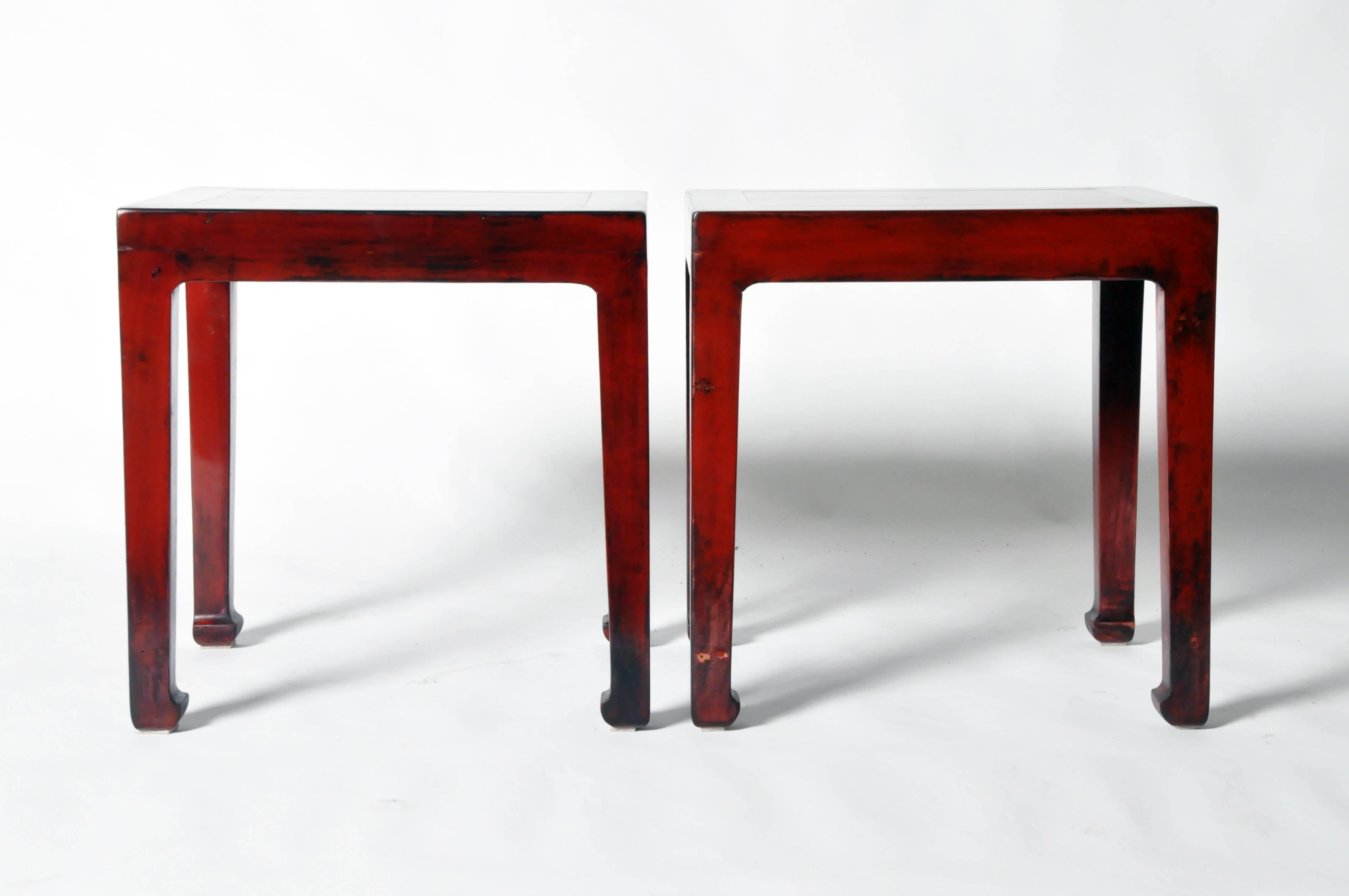 These Chinese side tables elmwood and has been fully restored. They also feature hoofed legs.