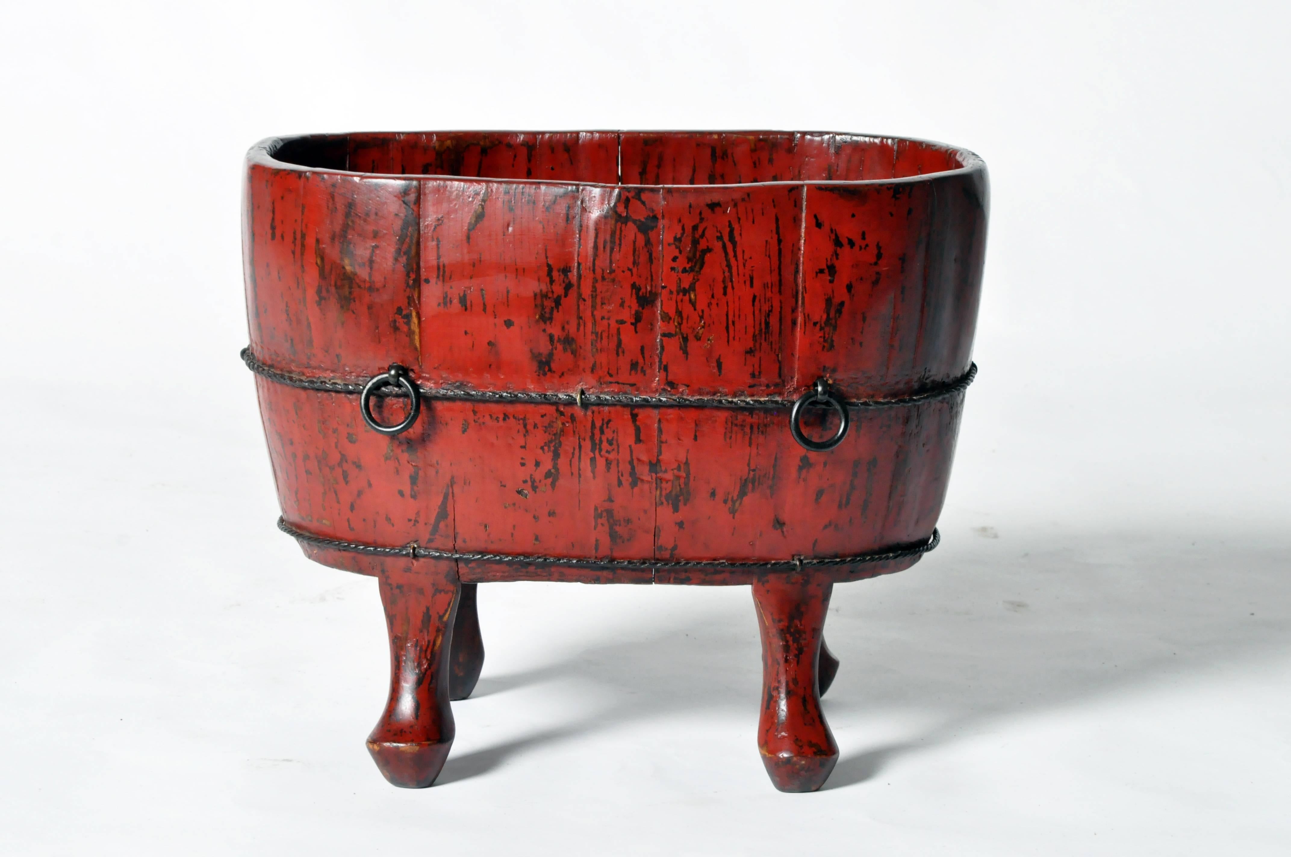 This Chinese pot is from Zhejiang, China and made from red lacquered softwood.