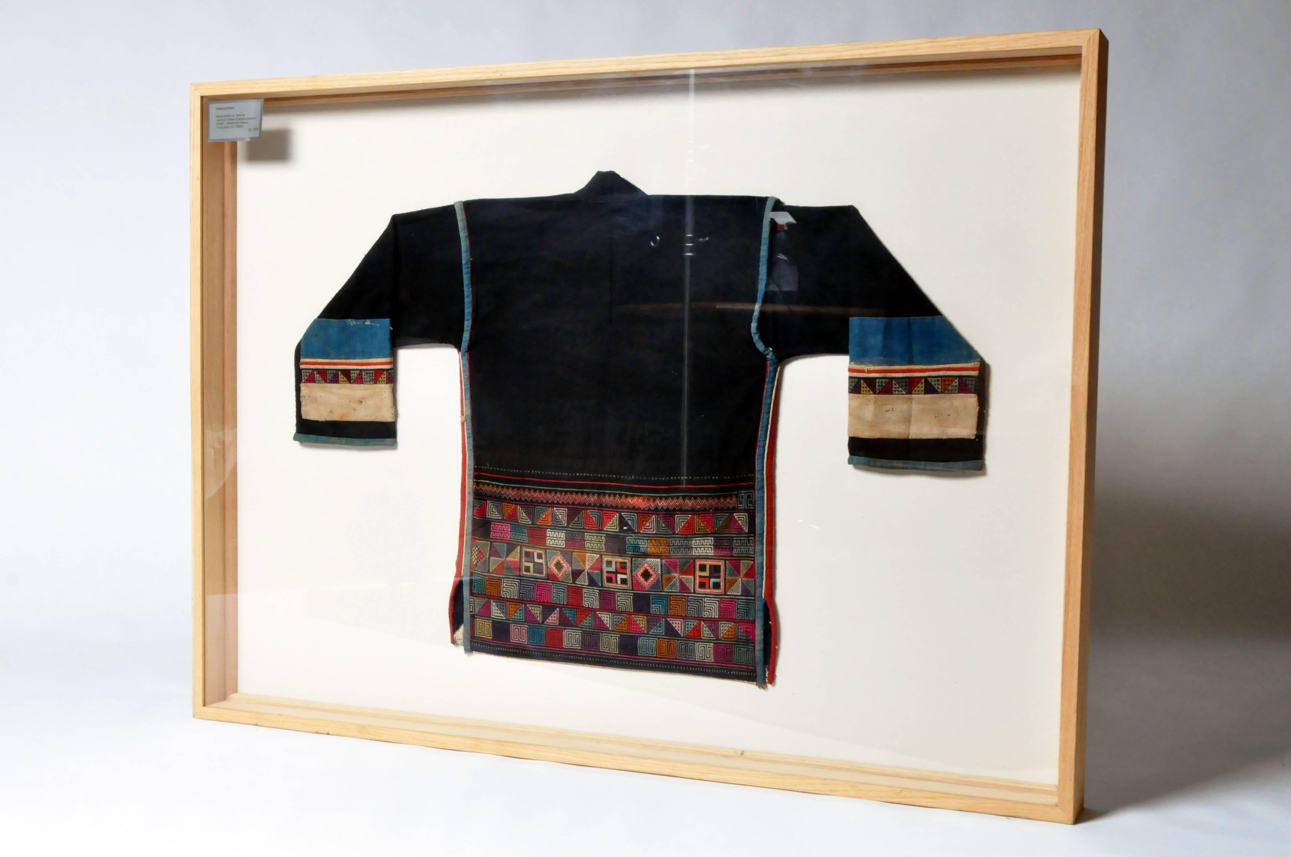 Framed man's jacket from the Akha tribe. The Akha are an indigenous hill tribe who live in small villages at higher elevations in the mountains of Thailand, Burma, Laos, and Yunnan Province in China. They made their way from China into Southeast