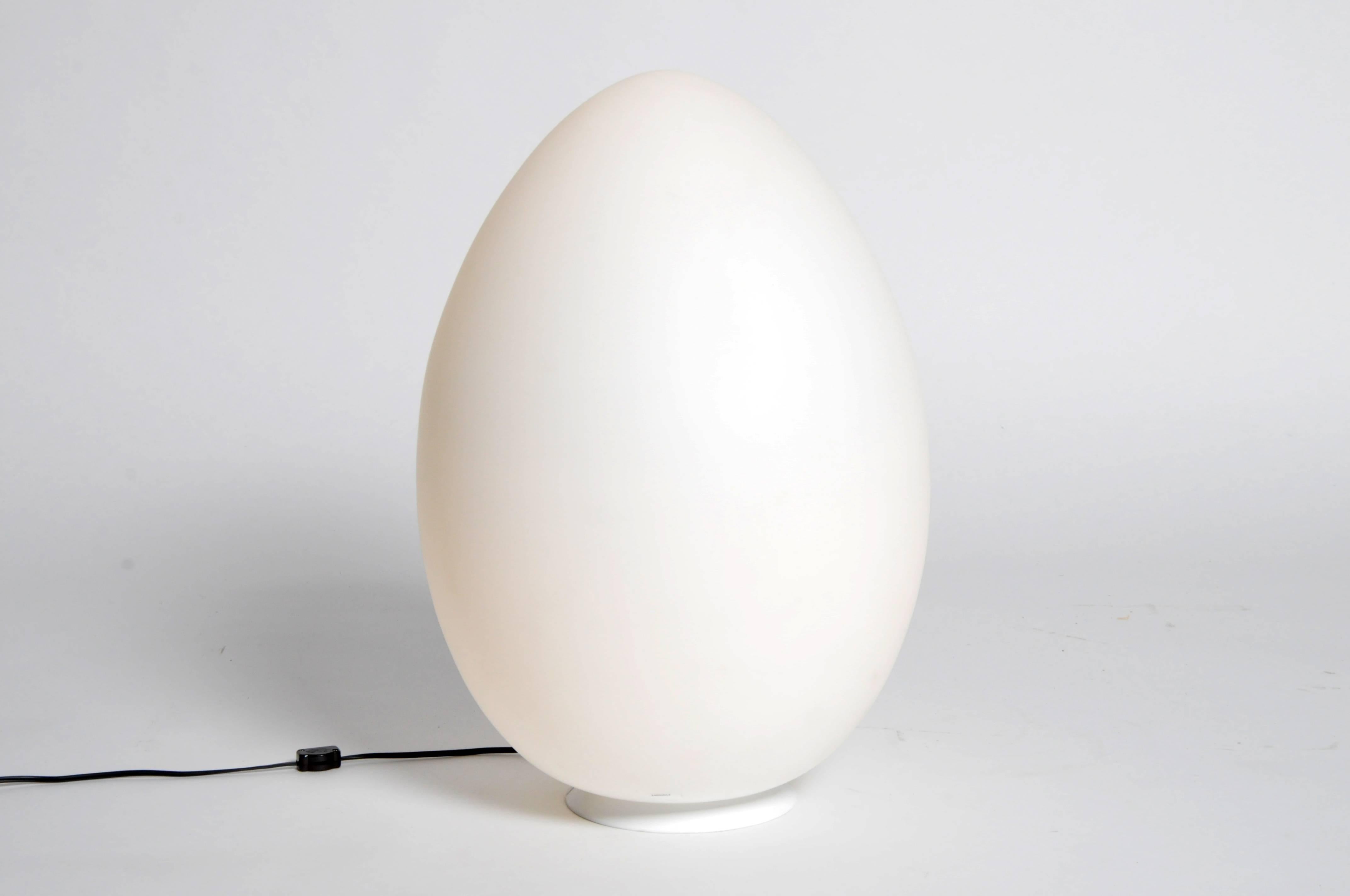 Made from handblown opaline glass, these lights are expertly crafted and emit a soft nebulous glow. The ovular streamline forms are secured to circular white metal bases. Chic additions to any modern interior, we also think they would look exquisite