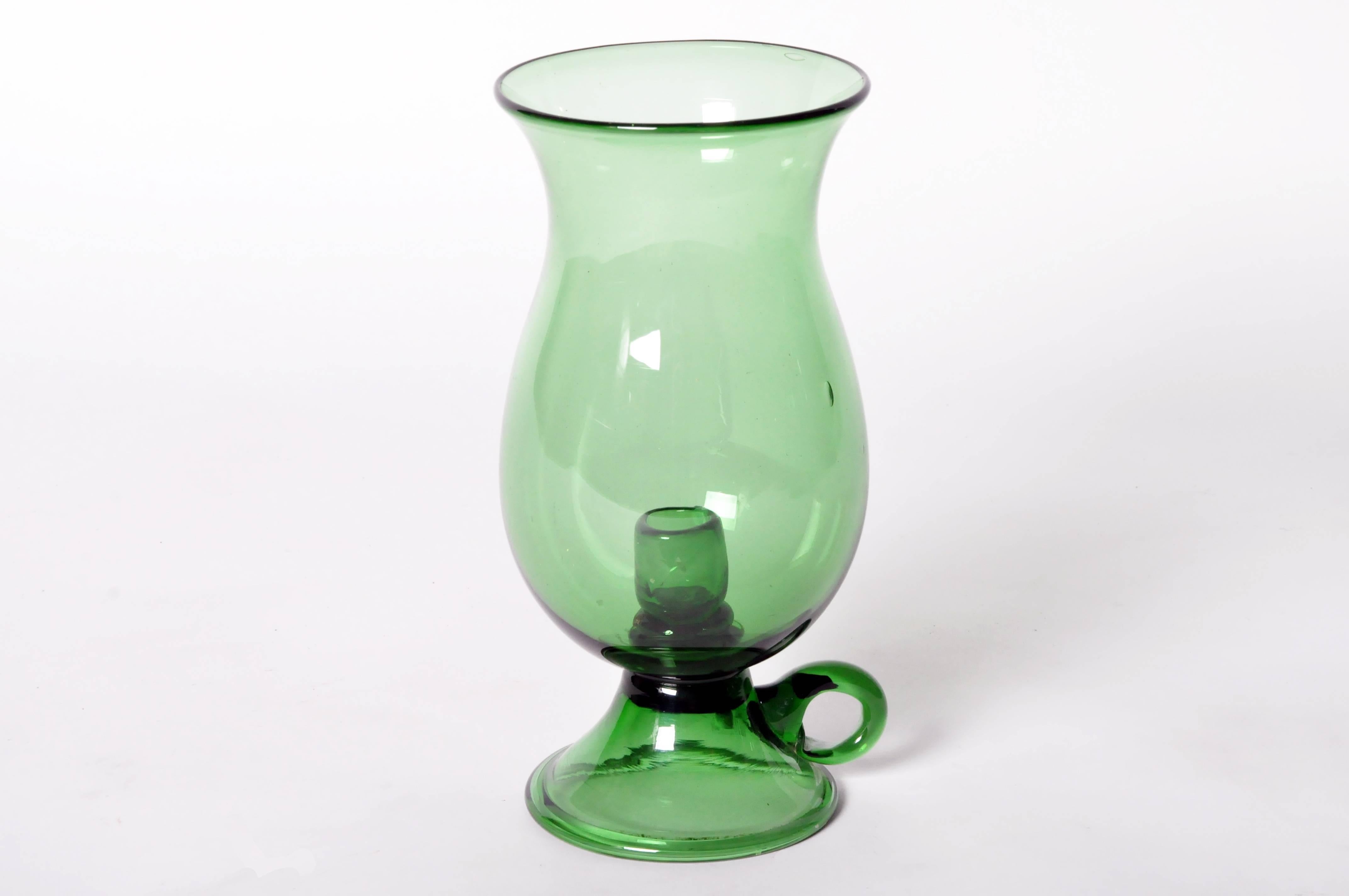 This emerald green taper candlestick holder makes a colorful addition to any mantel, side or entryway table.