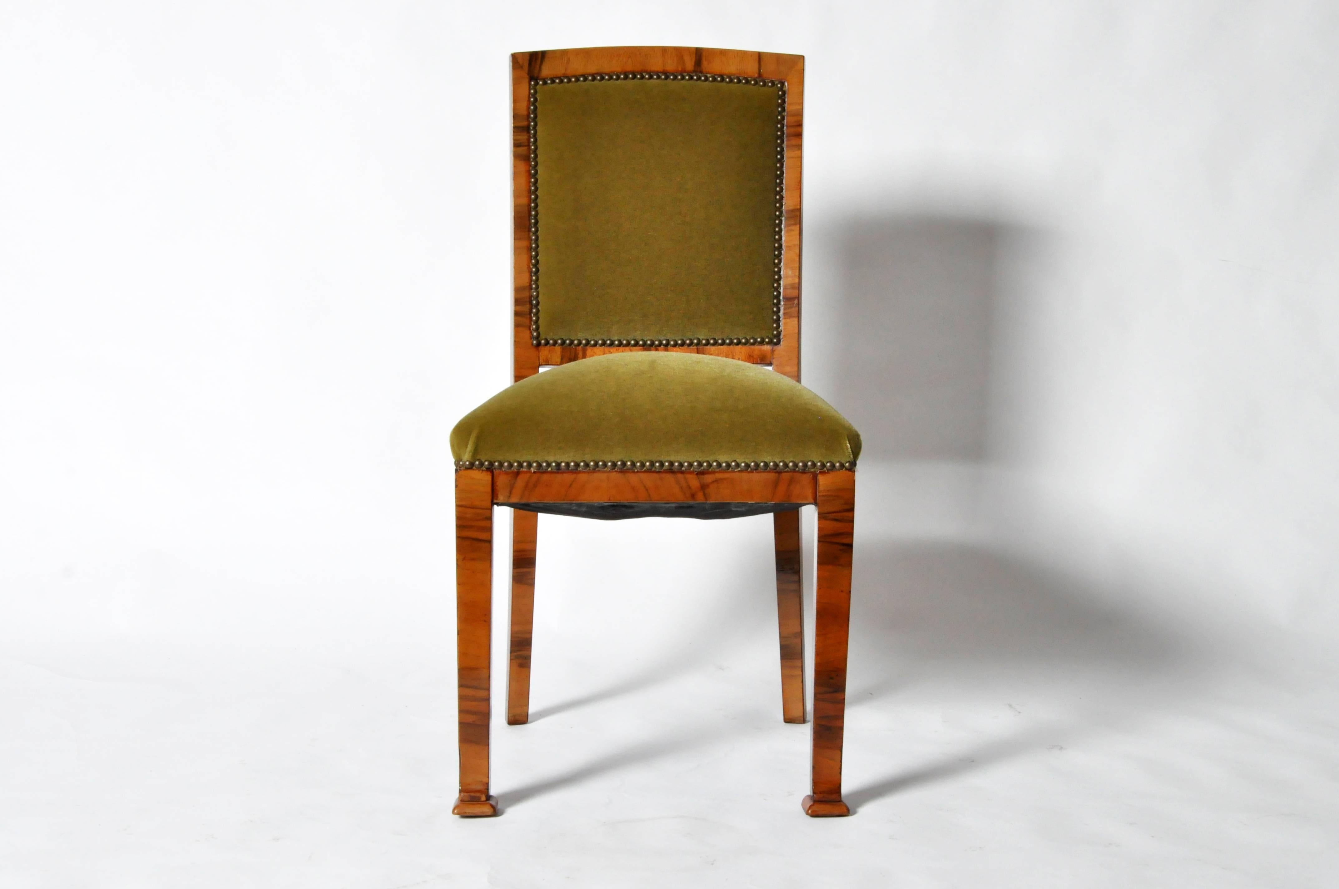 This set of six dining chairs are from Hungary and are made from walnut veneer, circa 1940.