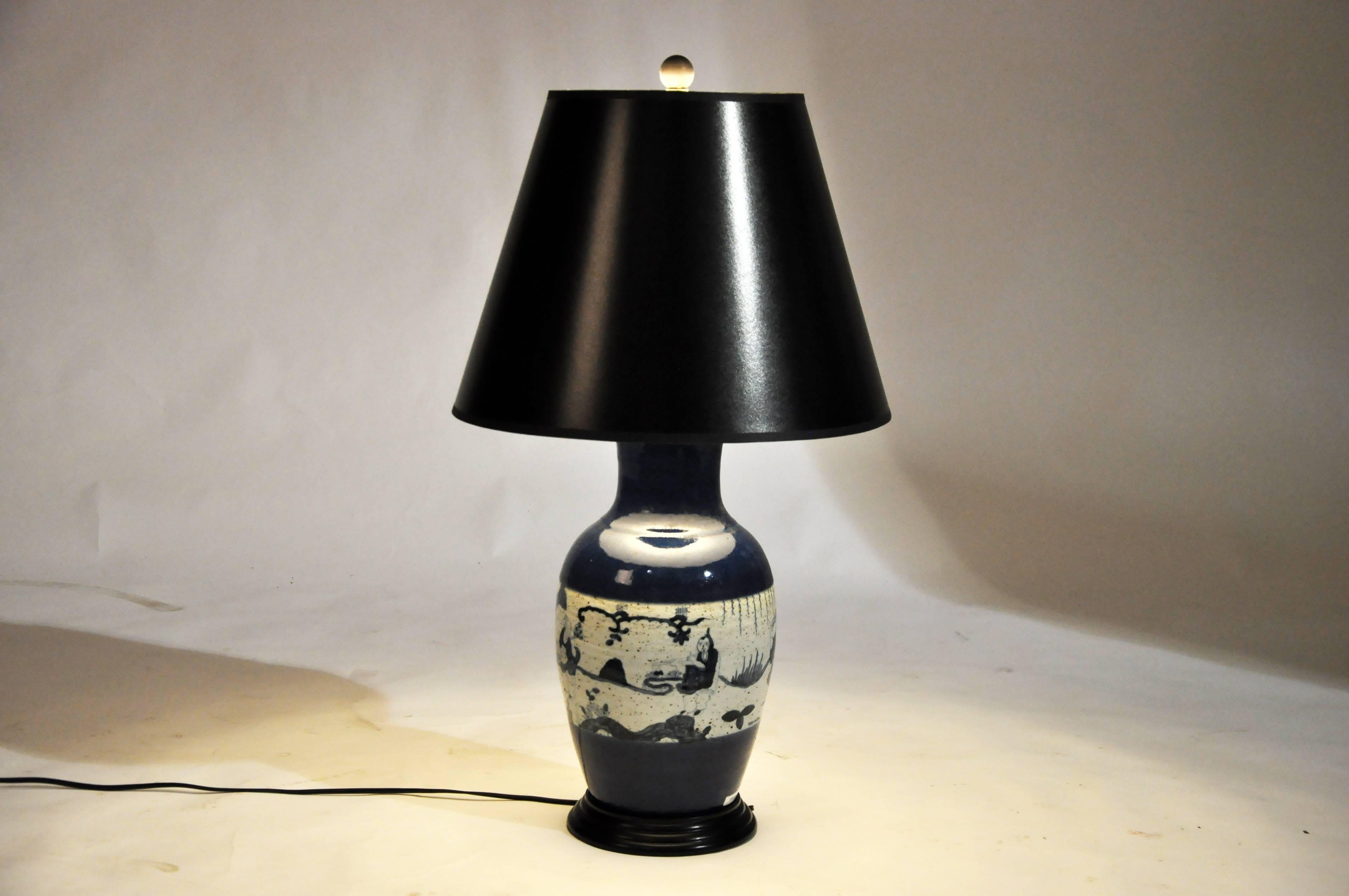 This blue and white ceramic vase from Beijing, China was converted into lamps and wired for use in the U.S.