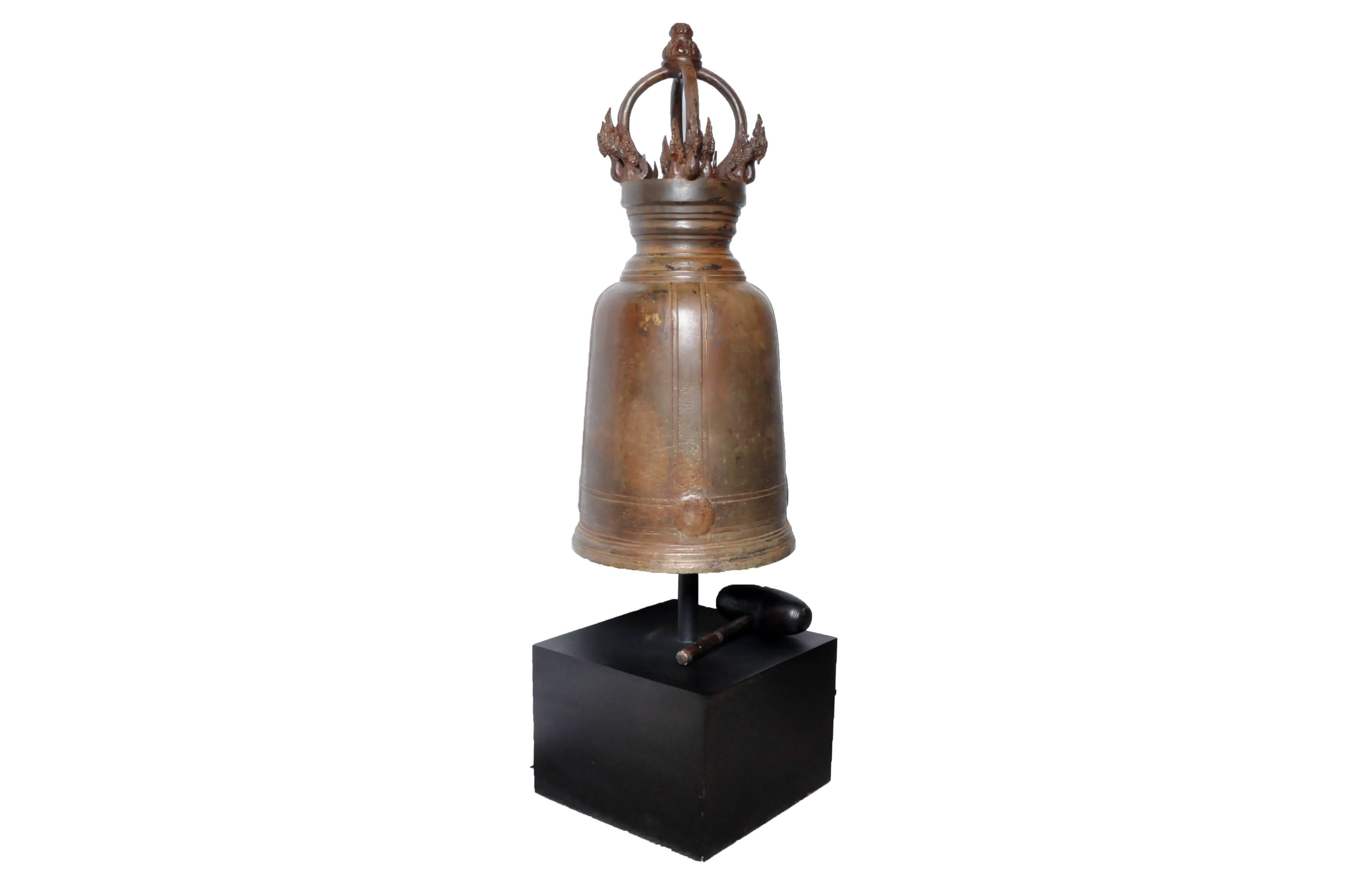 This Thai temple bell is from Central Thailand and is made from bronze, circa 1980. This temple bell features beautiful engravings and comes with a mallet. It lets of a meditative and calming ring when struck with the mallet. These temple bells were