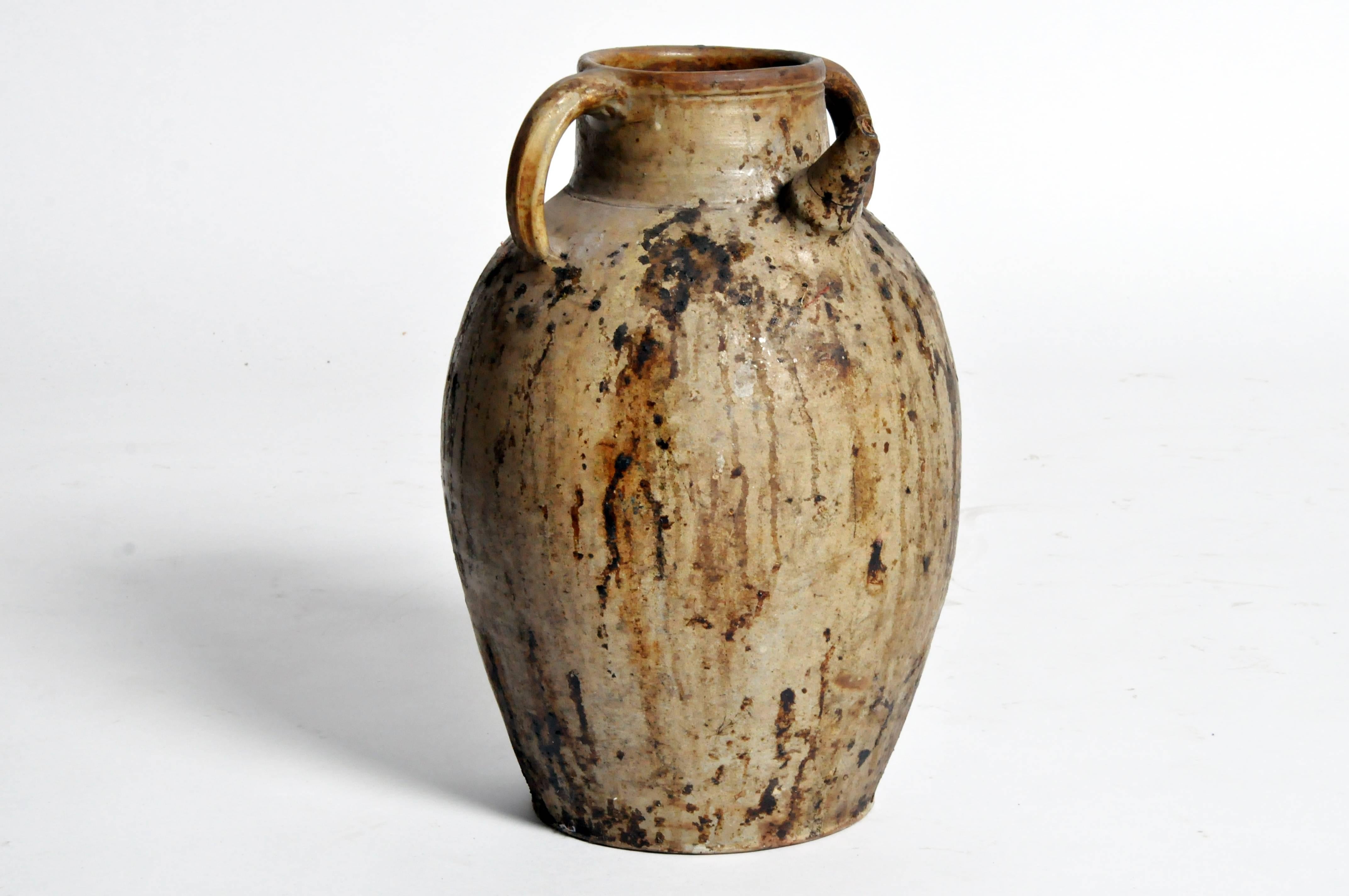 This wine jug is from France and is made from terracotta with ceramic glaze, 19th century.