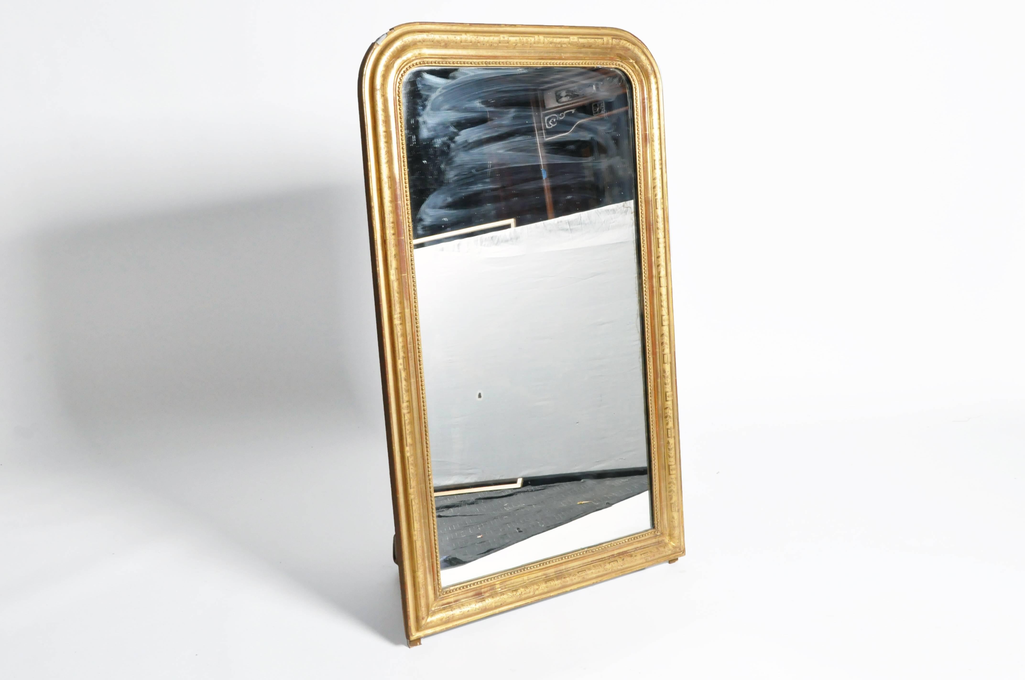 This elegant gilded mirror is from Italy and is made from pinewood, circa 1870. This piece features its original glass.