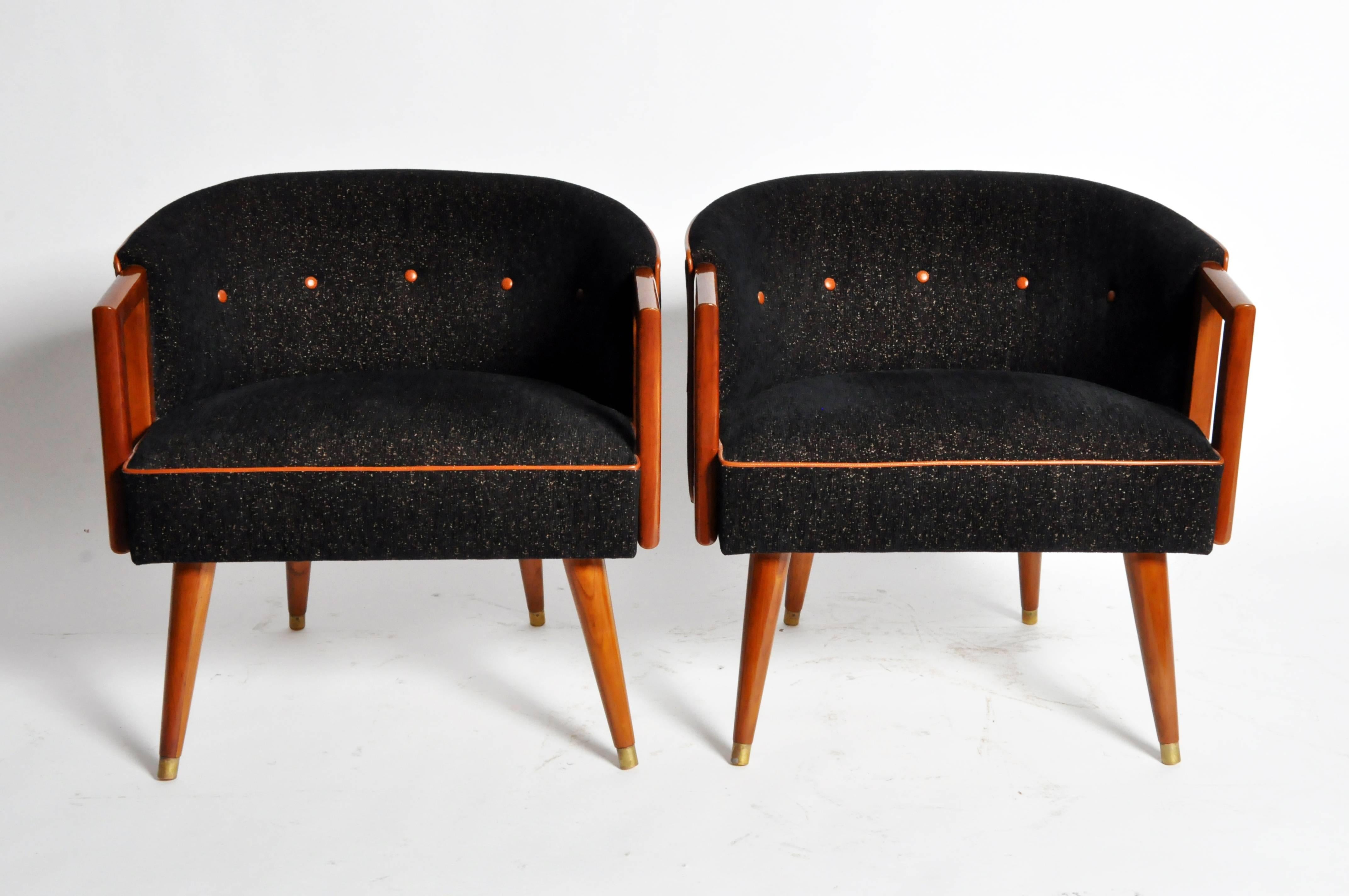 This handsome pair of round back chairs are from Italy and made from solid walnut, circa 1950.