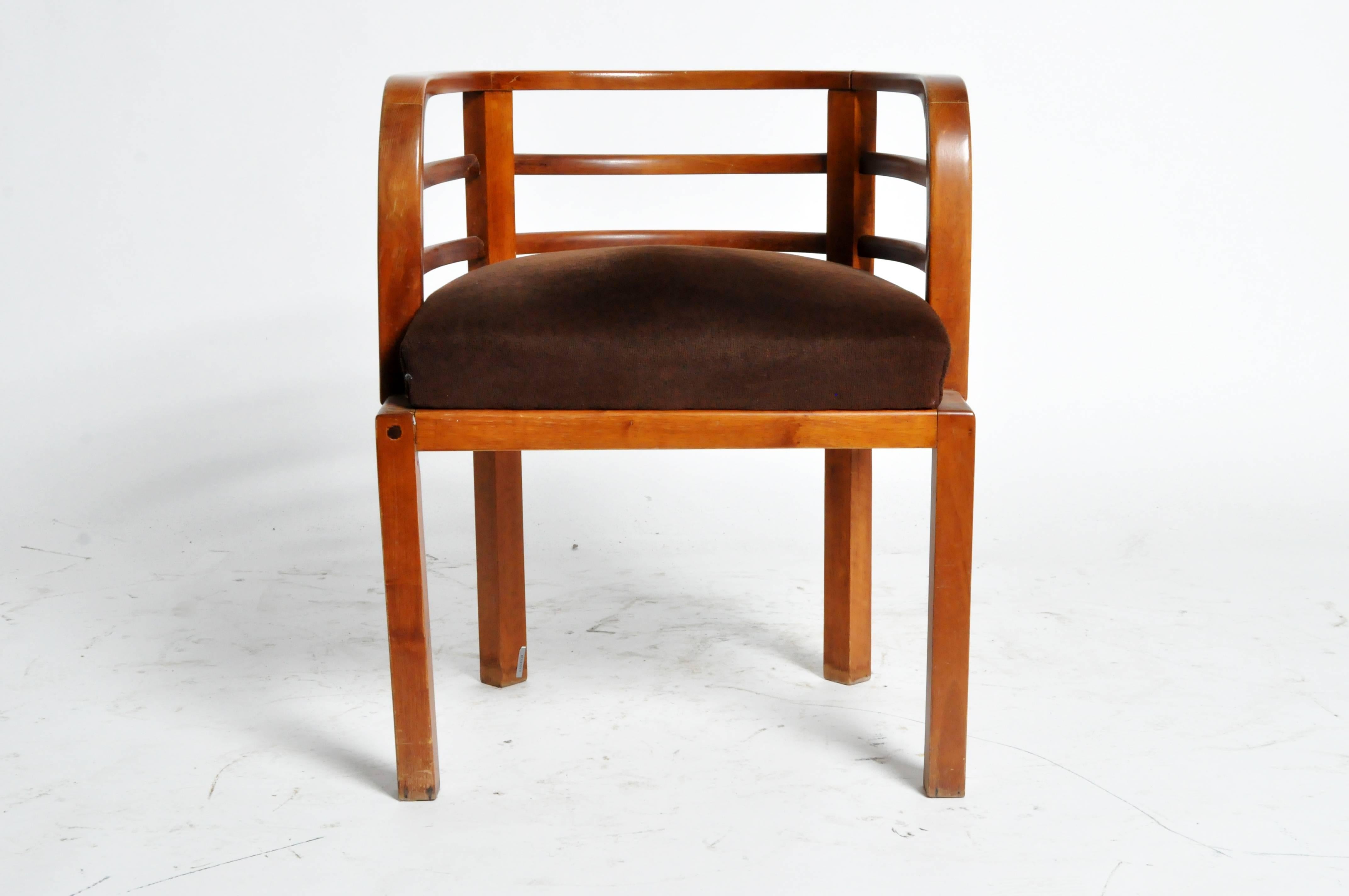 Eye-catching Hungarian round back chair in walnut. The compact, semicircular back to this piece is as comfortable as it is stylish. Its exposed structure demonstrates a modernist simplification of forms.