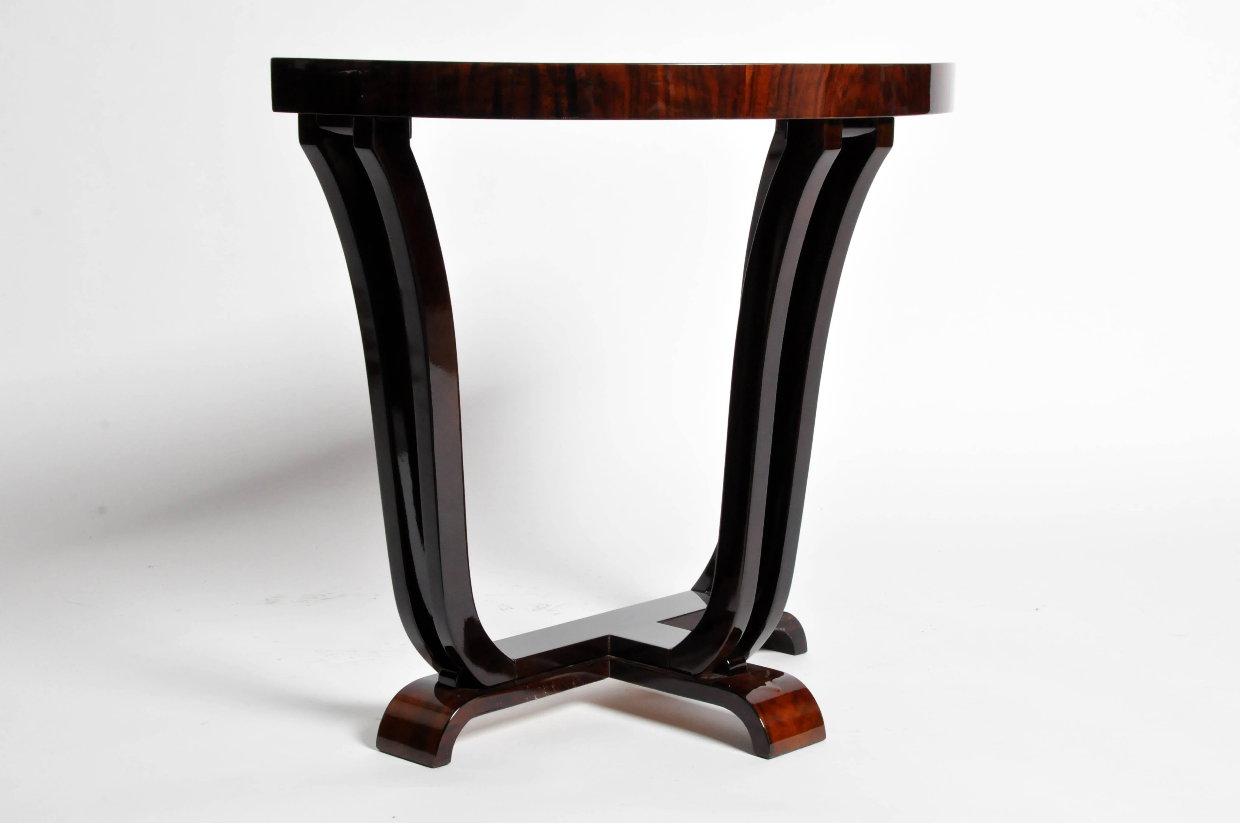 This gorgeous newly made Art Deco style half-round console is from Hungary and is made from walnut veneer. This piece has beautiful clean lines and is a great piece to accent any room.
