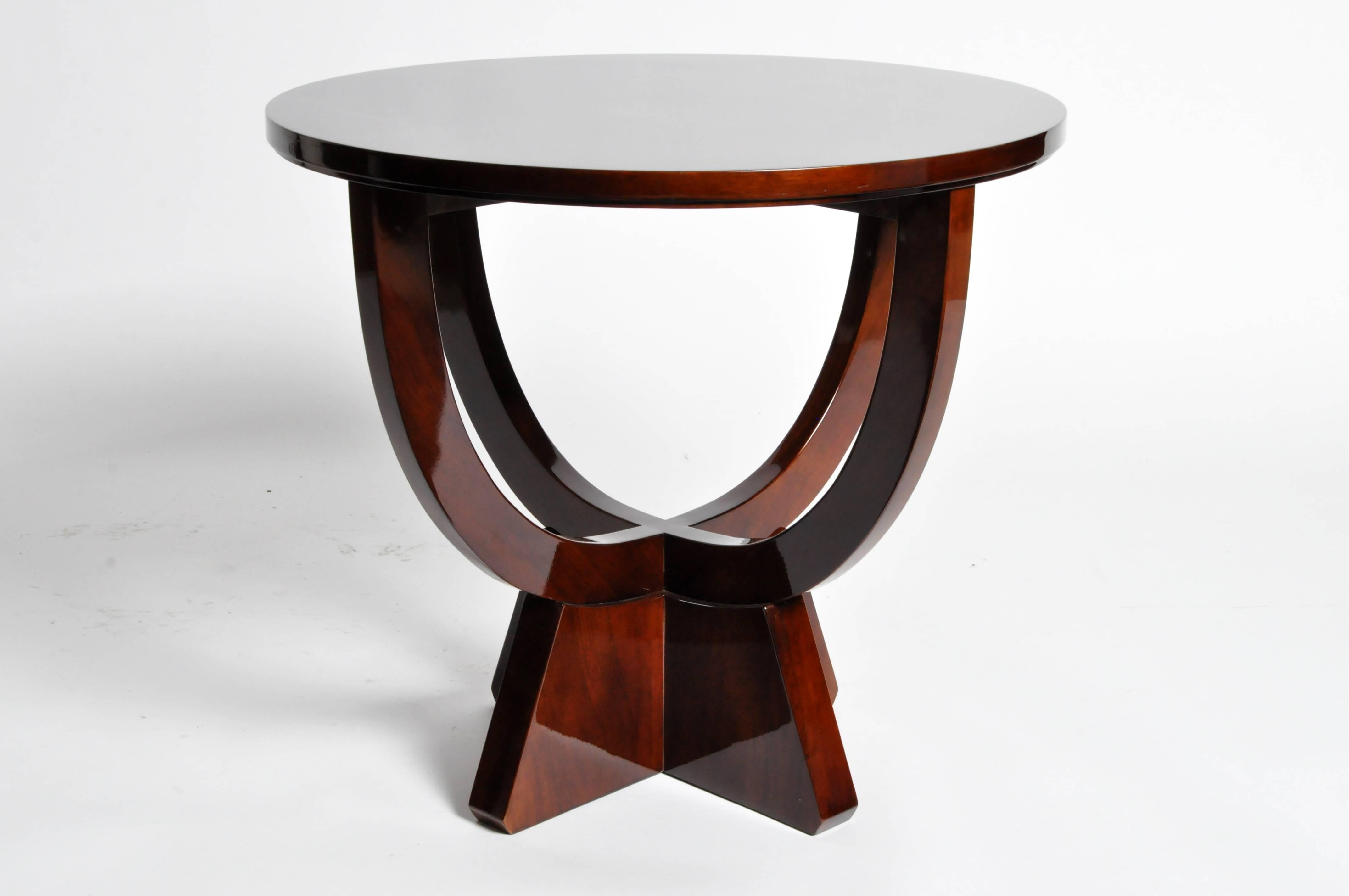 This elegant newly made round table is from Hungary and is made from walnut veneer.
