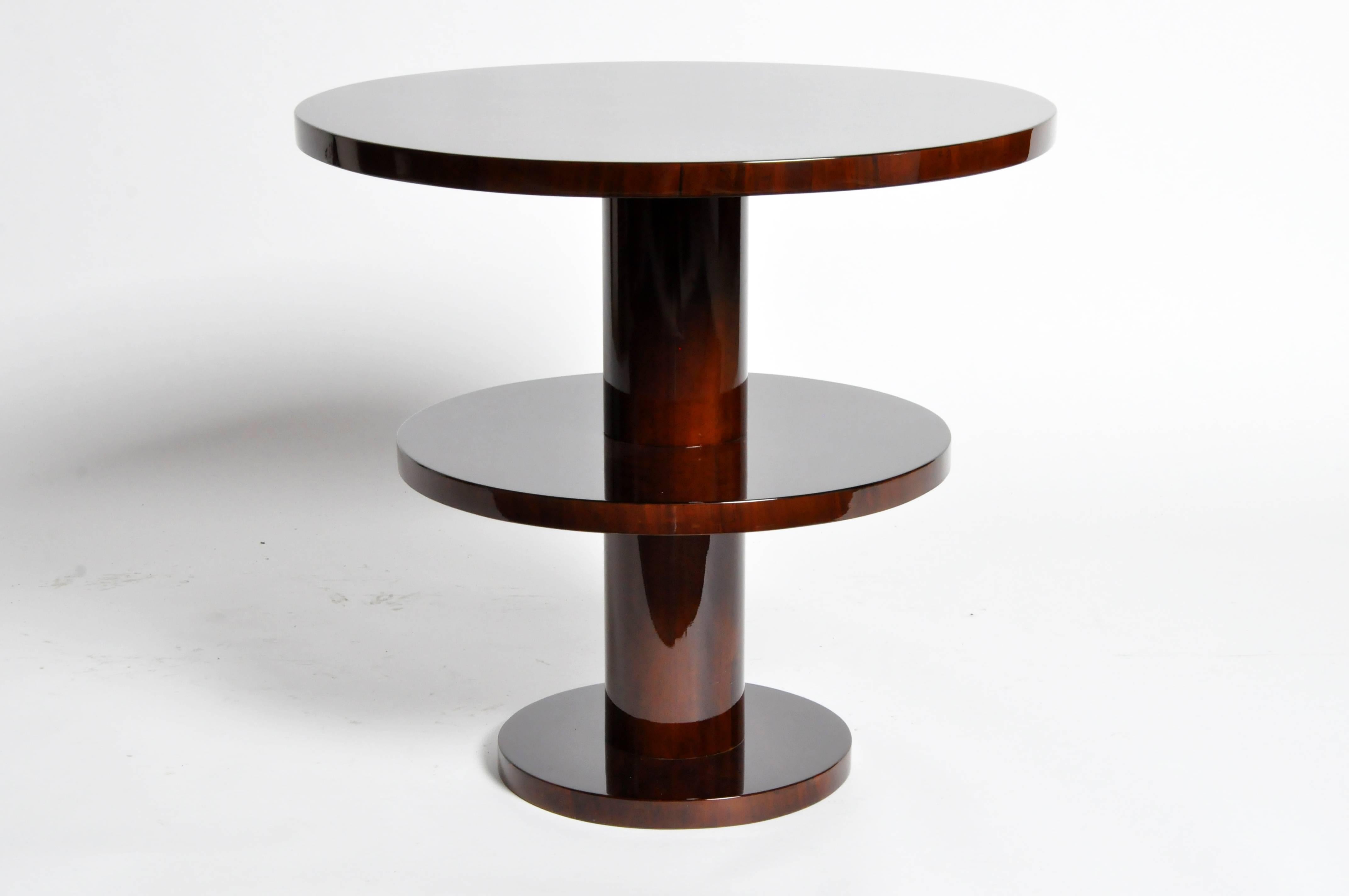 This gorgeous newly made Art Deco style round table is from Hungary and made from walnut veneer.