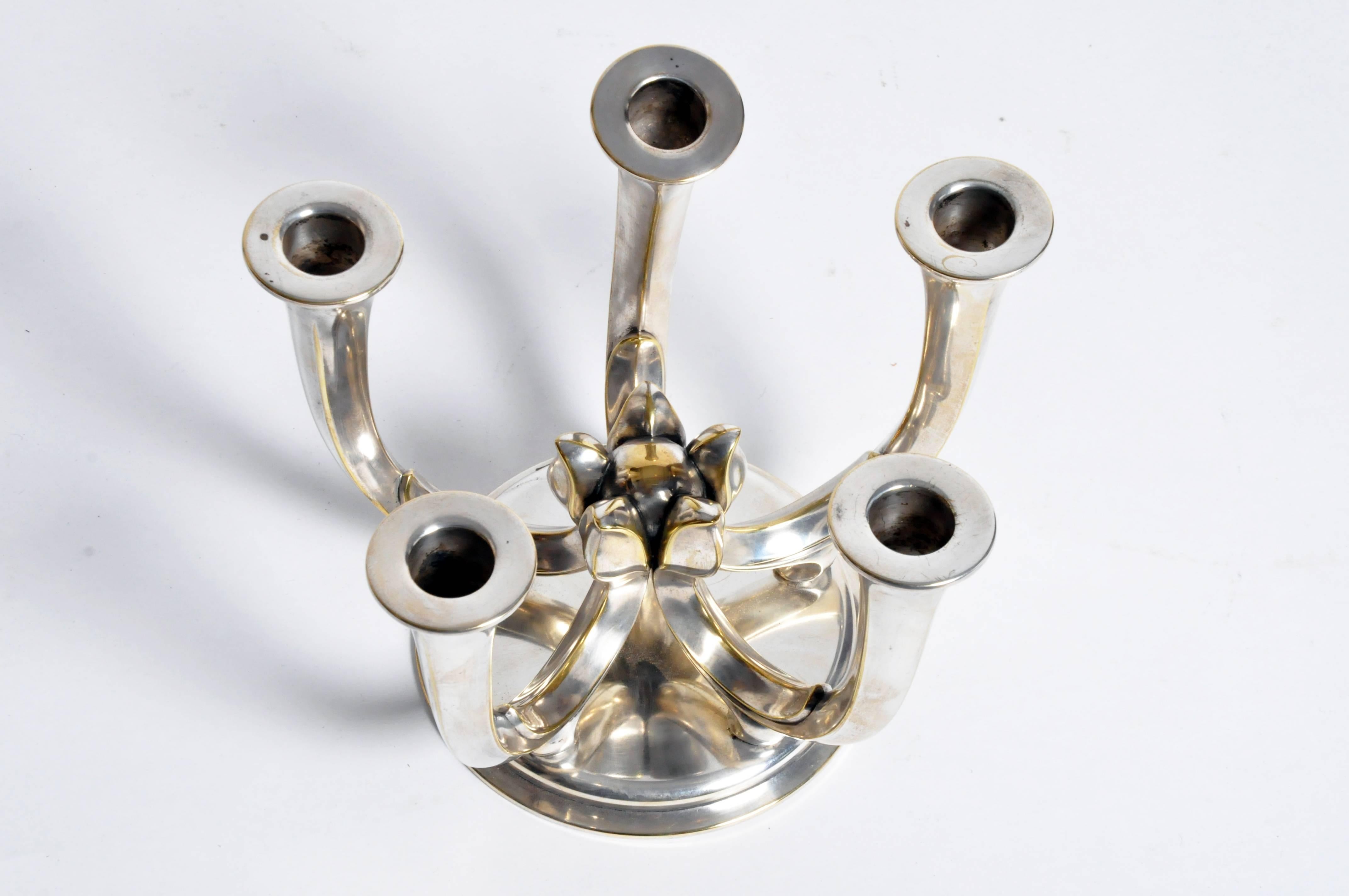This elegant candleholder is from Budapest, Hungary and is made from metal, circa 1920.
