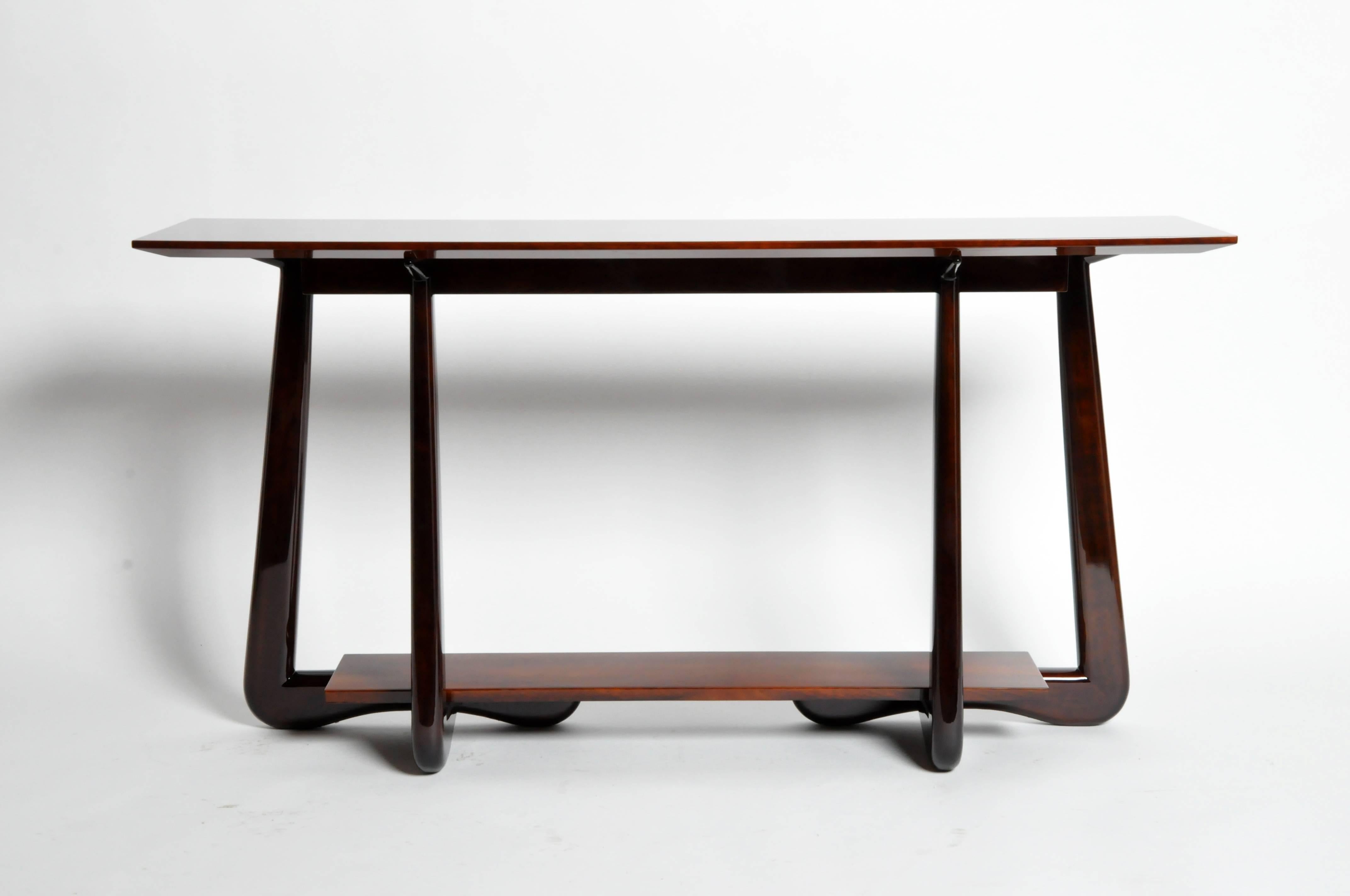 A rich vocabulary of Mid-Century design is evoked in this 1950s, French style console with walnut veneer. Beautiful combination of organic shapes and clean, simple lines.