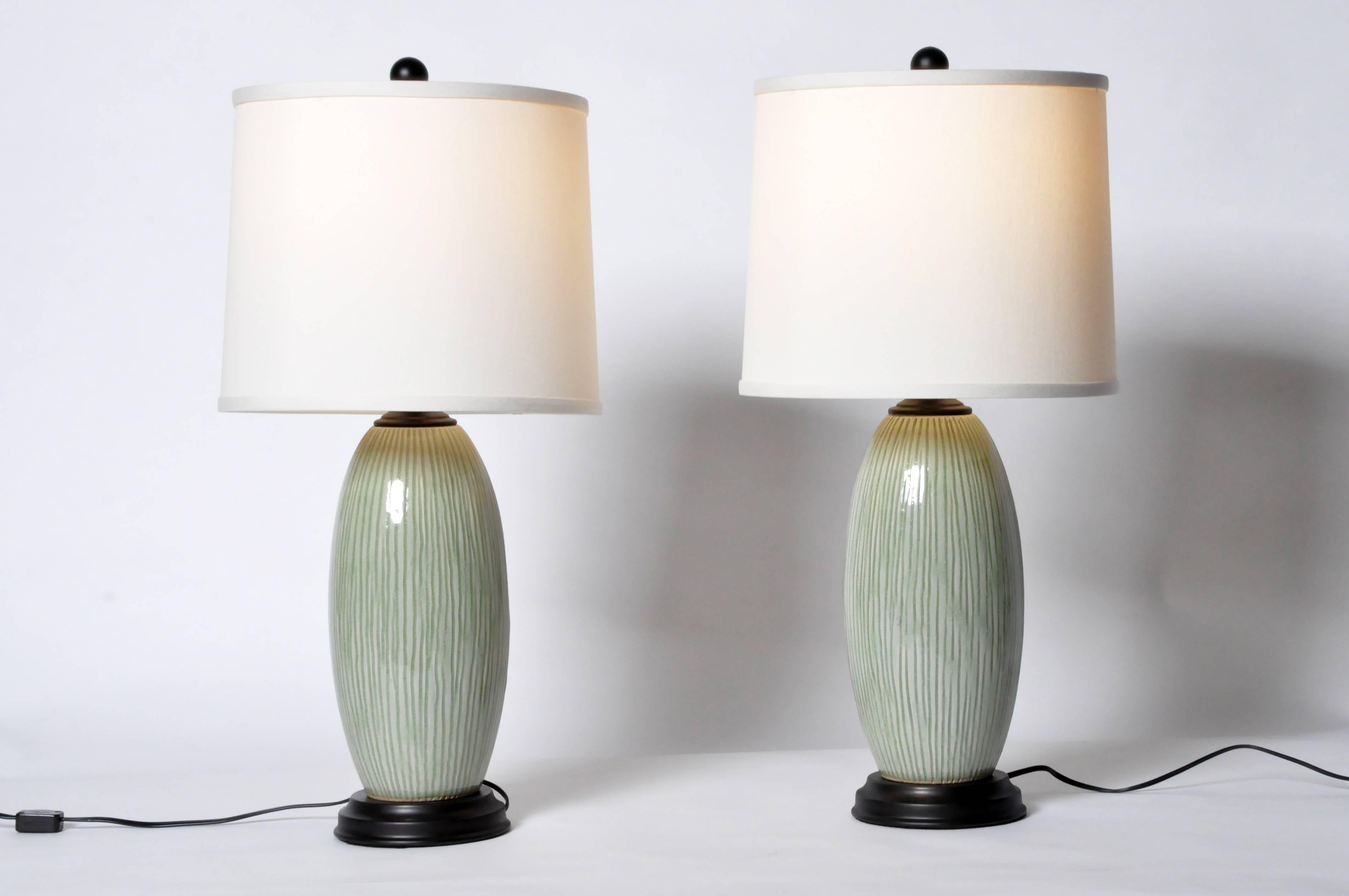 These beautiful green celadon vases are from Thailand and were converted to table lamps.