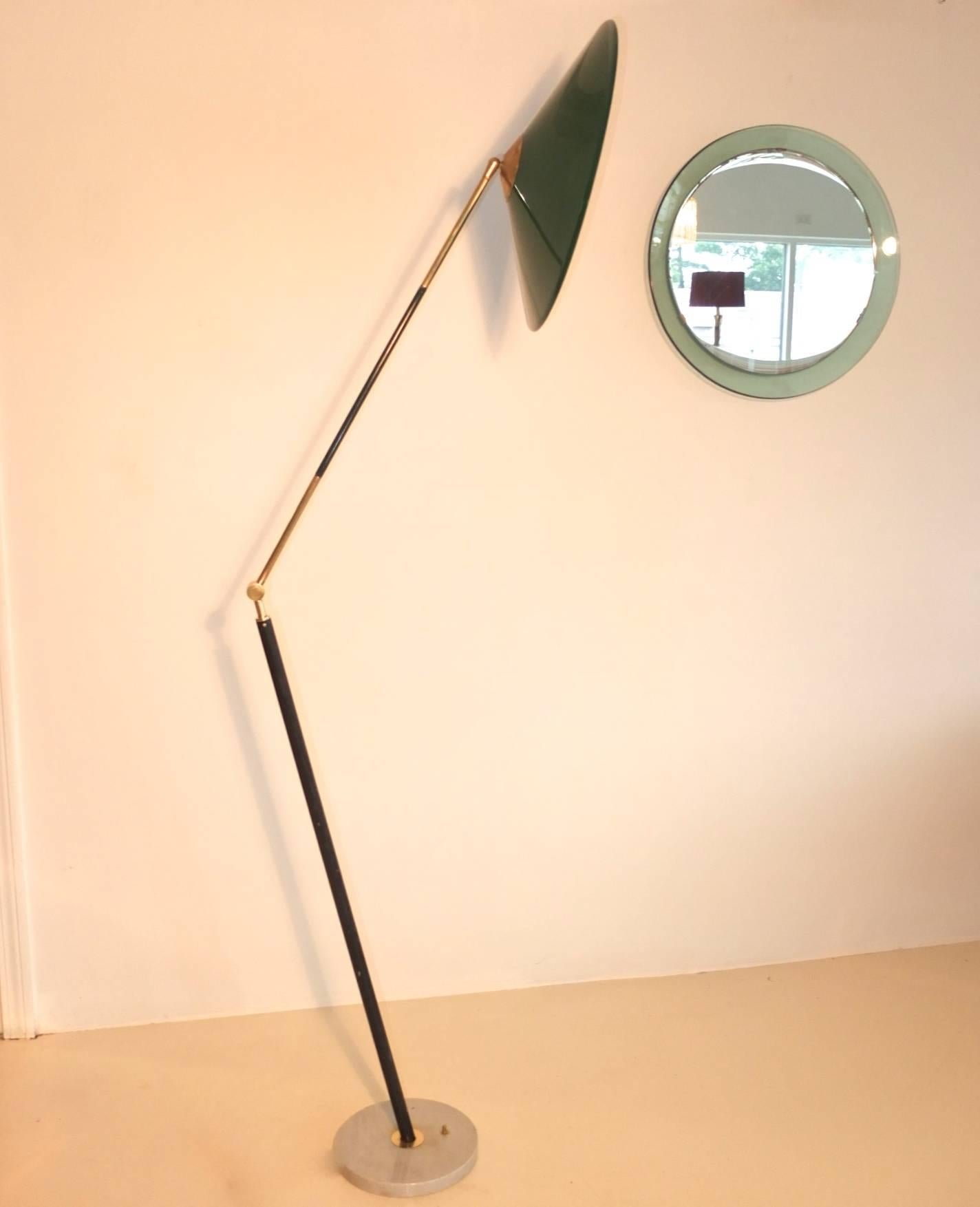 Stilux Milano 1950s floor lamp with distinctive leaning pole, long articulating arm with heavy duty solid brass elbow joint with a radius of over 180 degrees, allowing for some audacious poses. Long upper brass arm segmented by section in