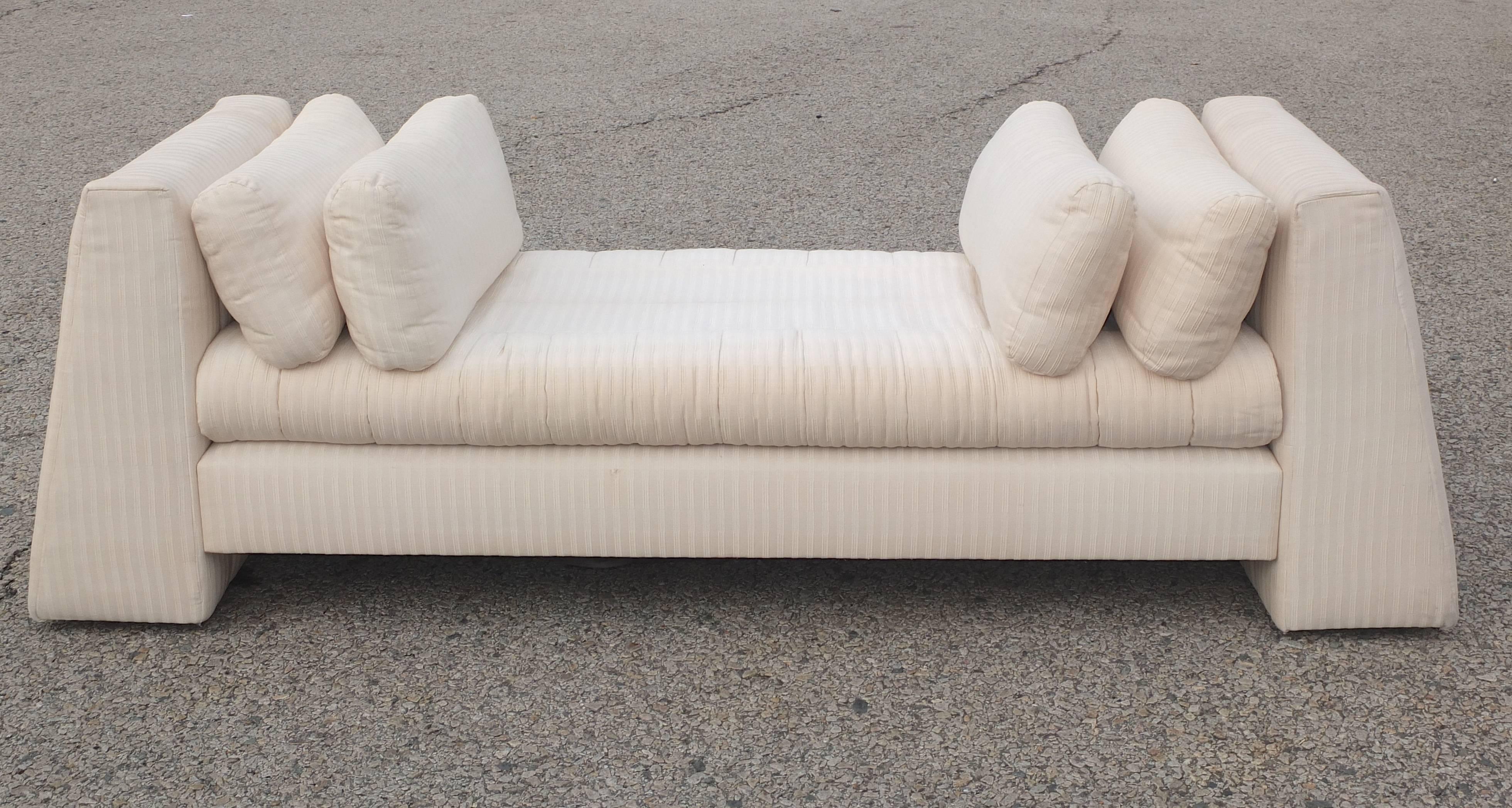 Custom upholstered long divan or chaise lounge designed by Juan Montoya for a published interiors project completed in 1991 in Georgetown DC. Fabricated and upholstered by Ken Flam, raised on an upholstered base, a loose cushioned seat flanked to
