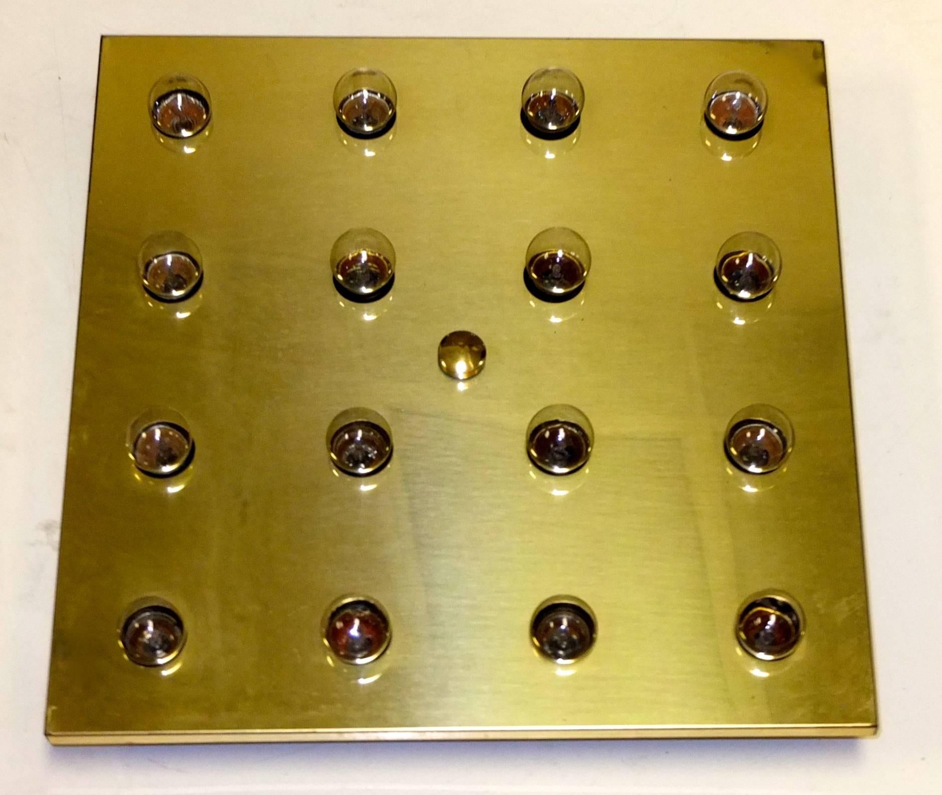 1960s polished brass square flush mount ceiling light by Lightolier which uses sixteen 7 watt bistro globe bulbs for a total of 112 watts.. 
Bulbs included are G50 7 Watt 120V Incandescent Globe Bulb, widely available.
Original Lightolier label