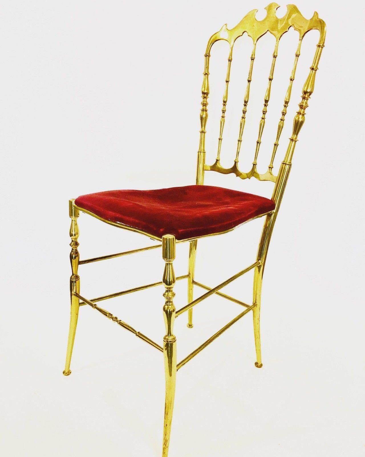 Solid polished brass Chiavari opera chair with daintily splayed feet. First designed by Giuseppe Gaetano Descalzi and continuously produced since the early 19th century in the Ligurian town of Chiavari. This solid brass version, made in Italy in the