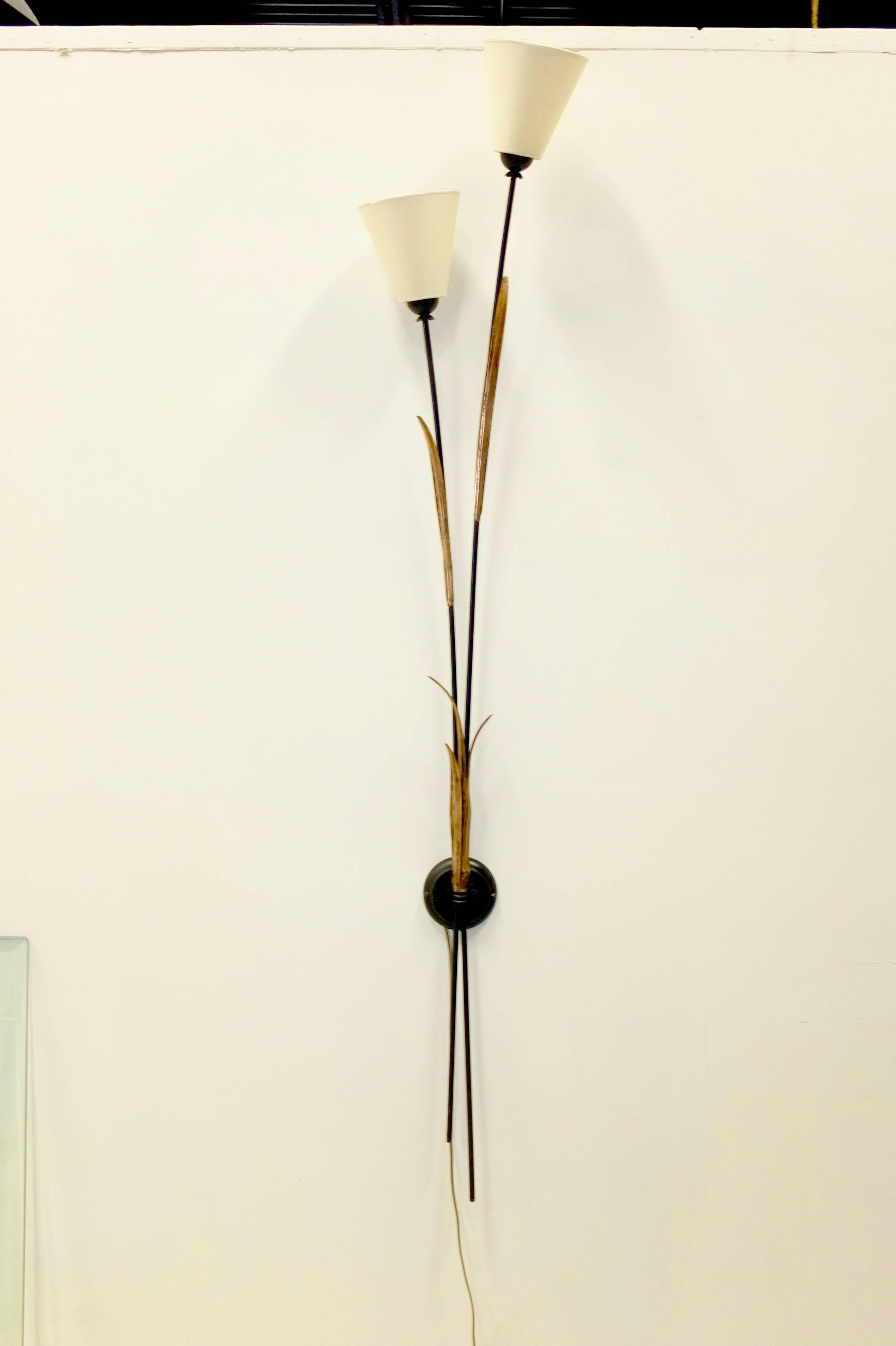 Original 1950's Italian wall mounted bracket sconce in the form of two long stalks of a flowering plant made of gilt and black enameled tole. 65 inches long not including the shades....69 inches with the shades.

Presently corded but can be