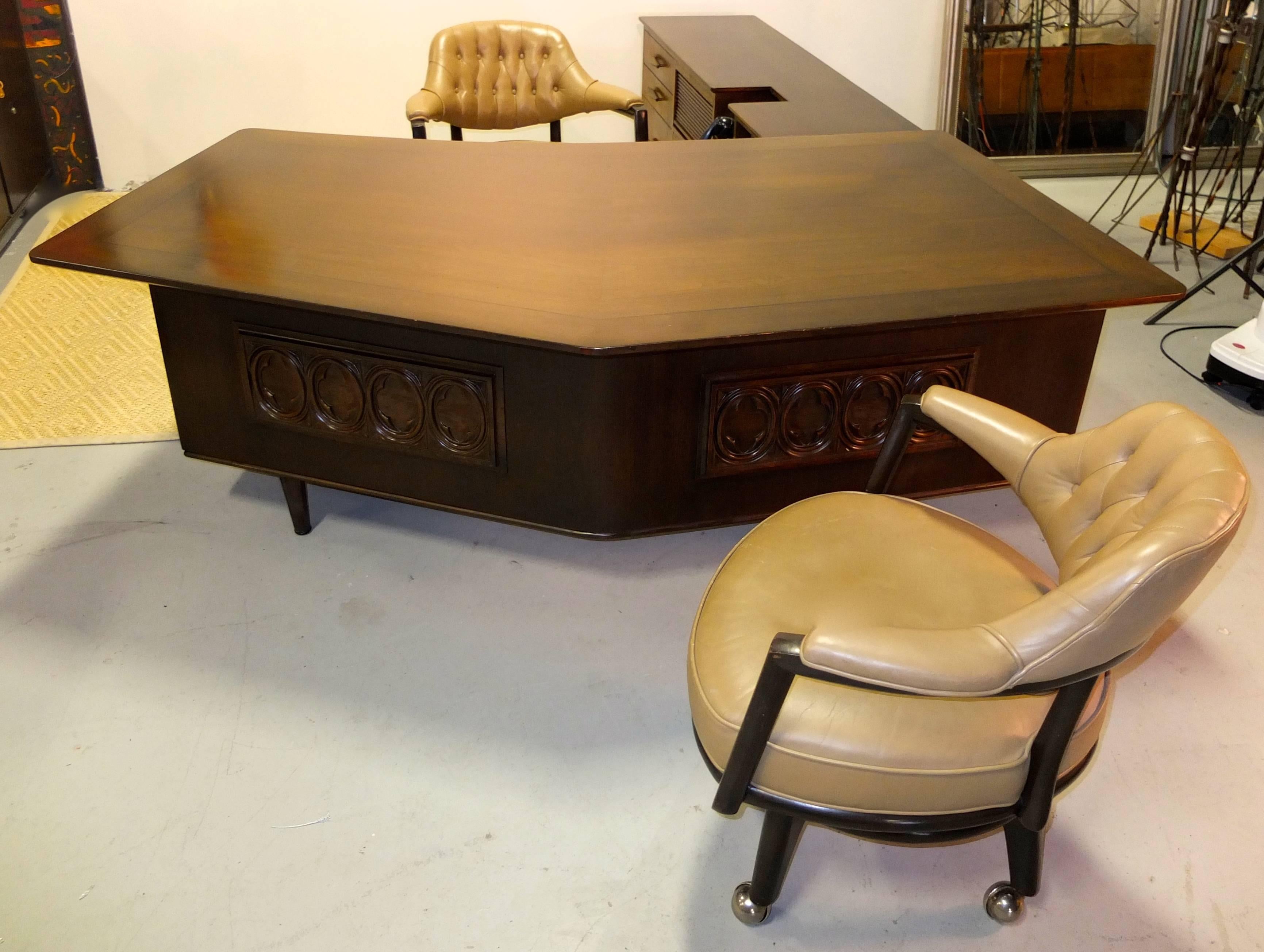 Maurice Bailey designed this executive office suit, circa 1959 for Monteverdi-Young. We acquired it directly from the original owner, a retired lawyer in Beverly Hills, CA.
Stylish stealth bomber walnut desk with off centered peaked table top in