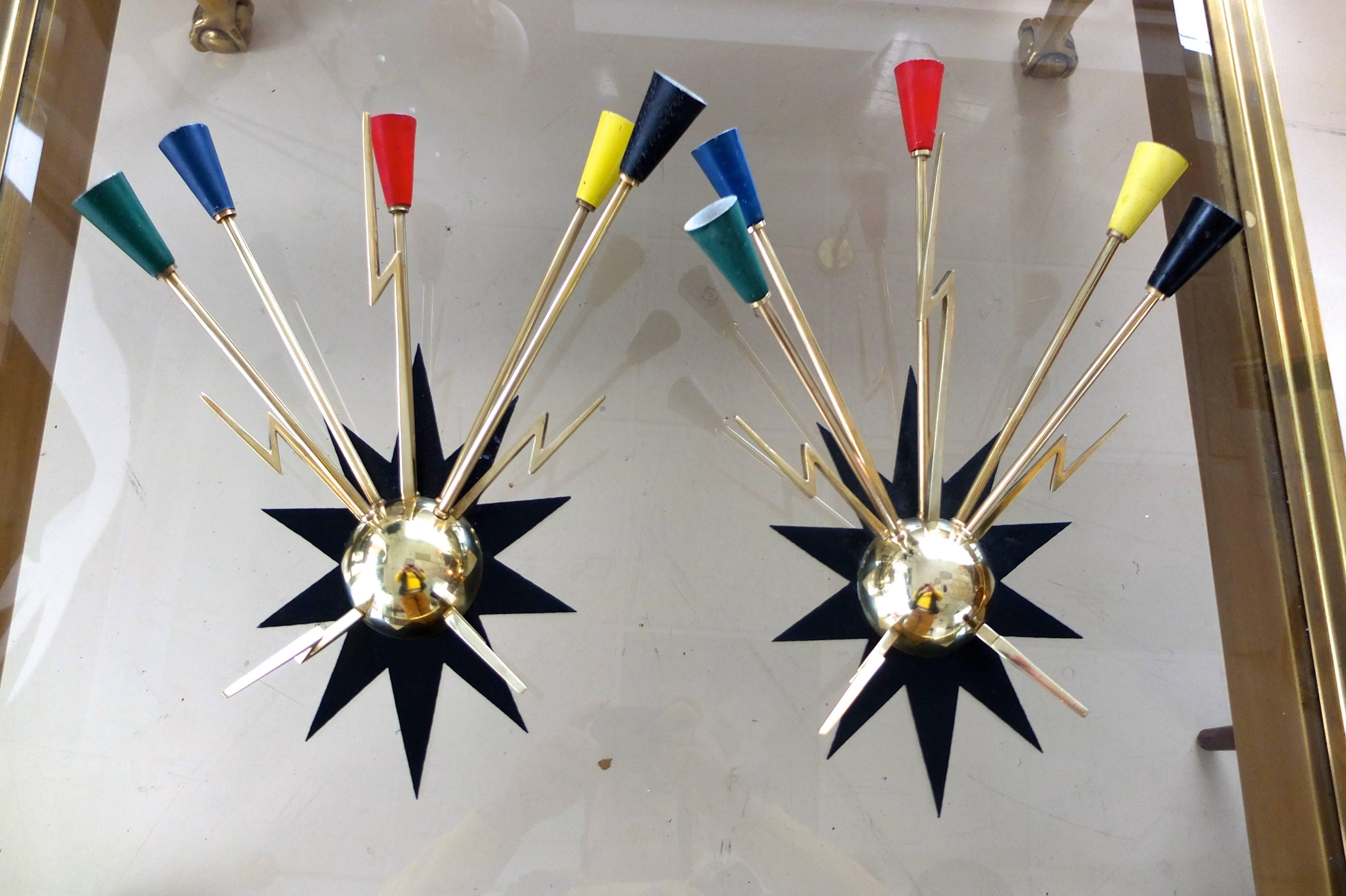 Spectacular custom made for the music hall, Casino de Paris, rue de Clichy, a pair of wall mounted sputnik sconces each with five solid brass arms tipped with color enameled aluminum cones radiating from the top of a solid brass half sphere and
