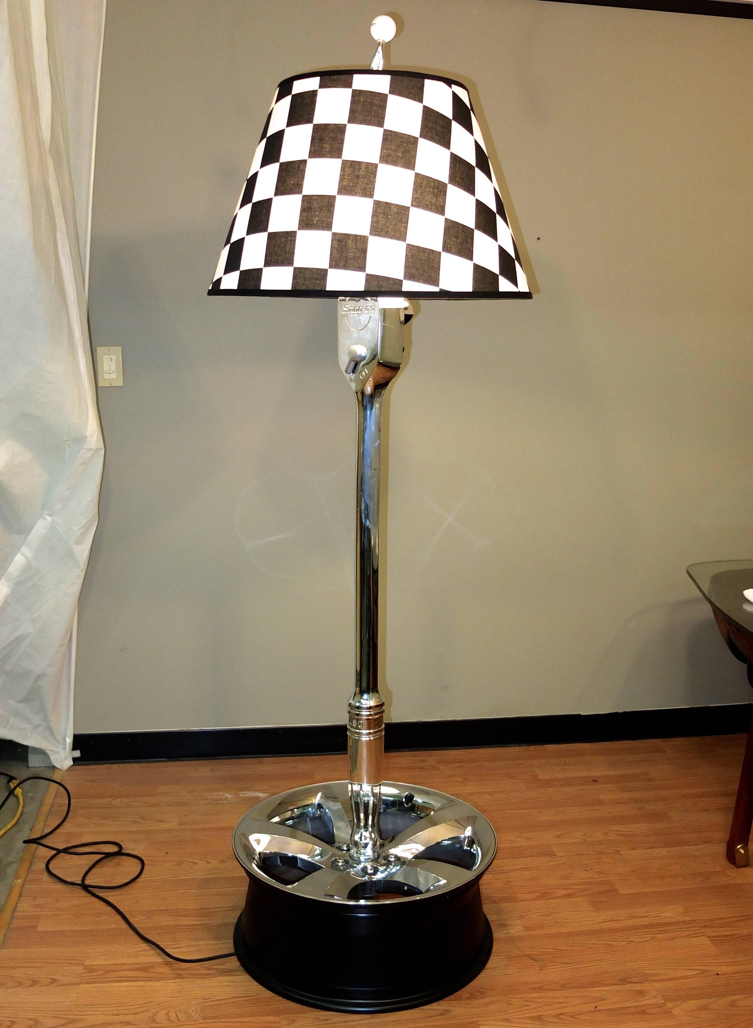 The inspiration behind this floor lamp was the discovery of a vintage giant Snap-On ratchet wrench promotional advertising display prop in pristine vintage condition. 

When setting about to convert this found object into a floor lamp the our