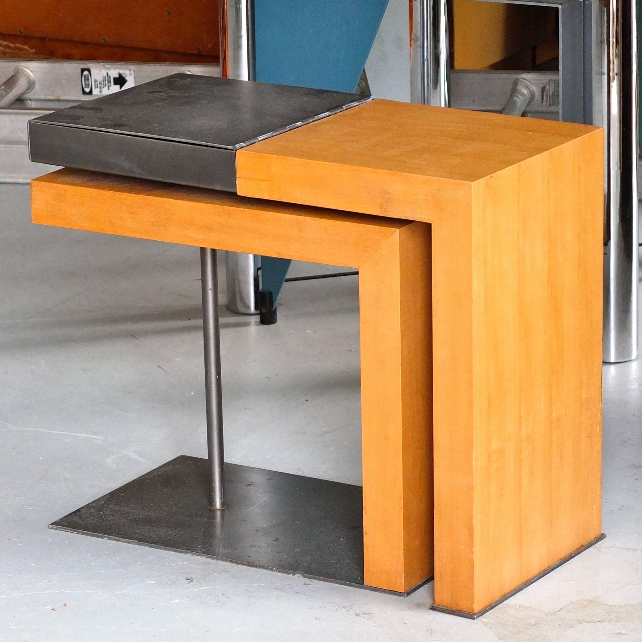Rare adjustable occasional table from Ecart International, a creation of the in-house design office under the artistic direction of Andrée Putman, circa 1995.

Maple butcher block pivoting double structure with steel plate and tube, anthracite