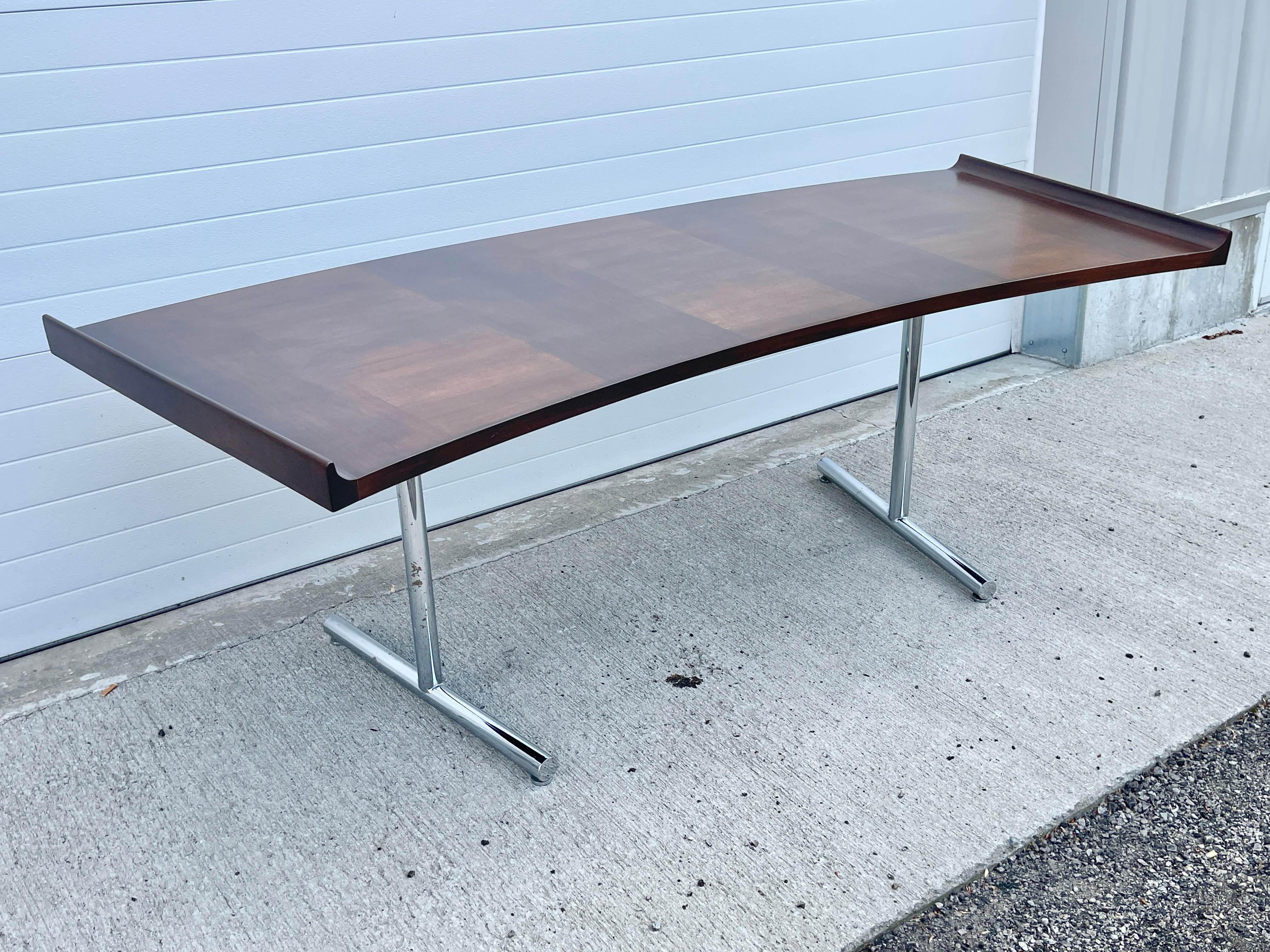 Impressive and sculptural curved top executive desk in walnut by Harvey Probber. 
Panoramic scale 84