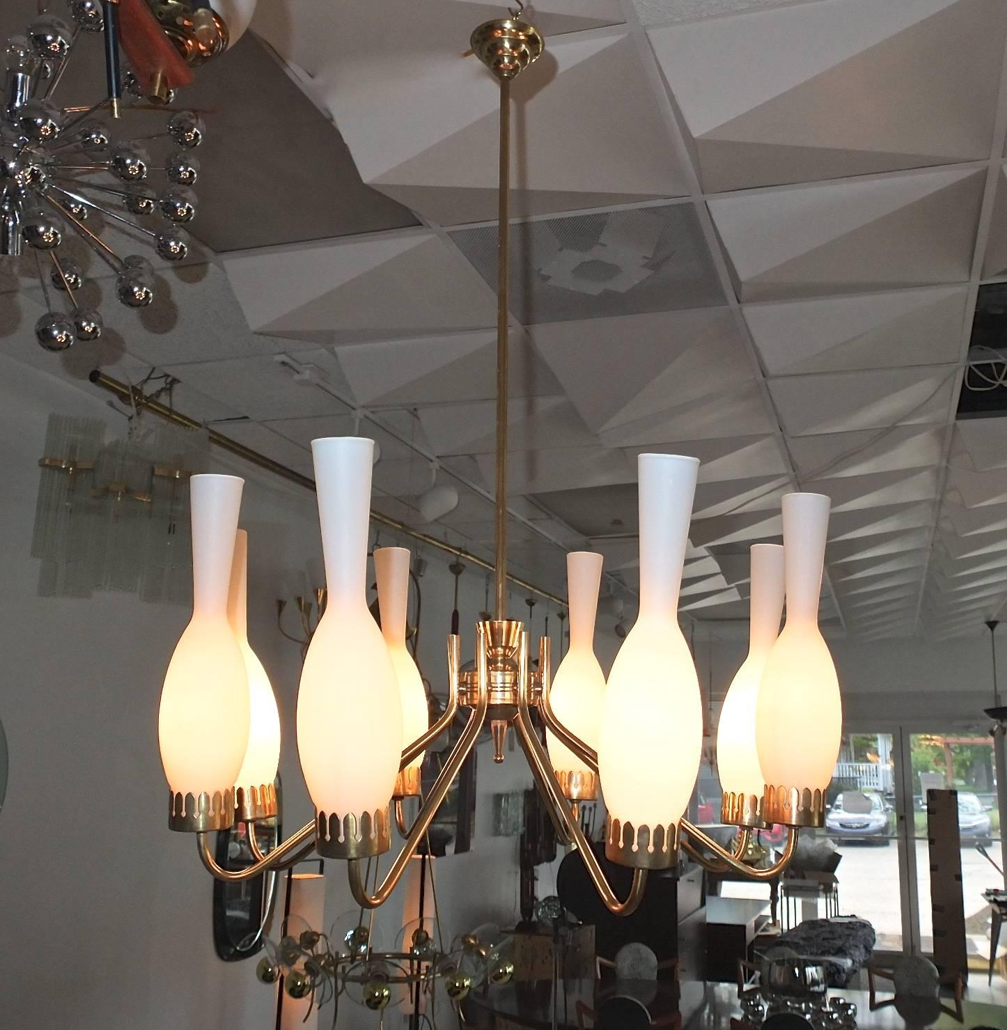 1950s Italian brass eight-arm chandelier with eight bottles or bowling pin shaped opaline glass globes, each one illuminated with a single candelabra size bulb. Rewired. We can lengthen or shorten the stem per request.

Measures: 23 inches