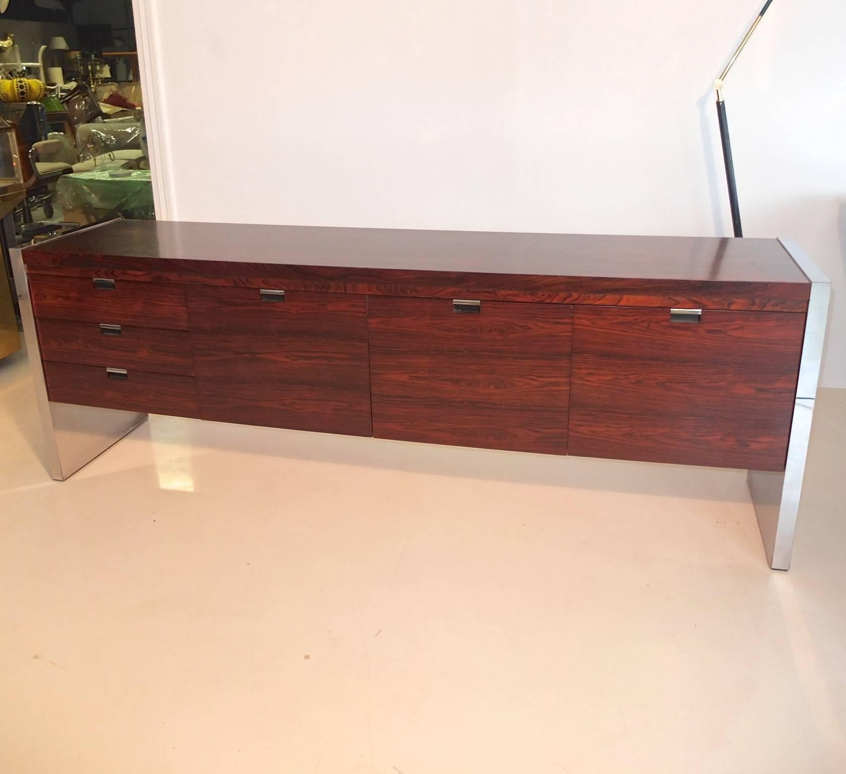 Richly grained rosewood credenza designed by Roger Sprunger for Dunbar for its executive collection. Four sections of drawers: Three smaller drawers and three large drawers for file folders (at last, something chic in which to hide all your papers