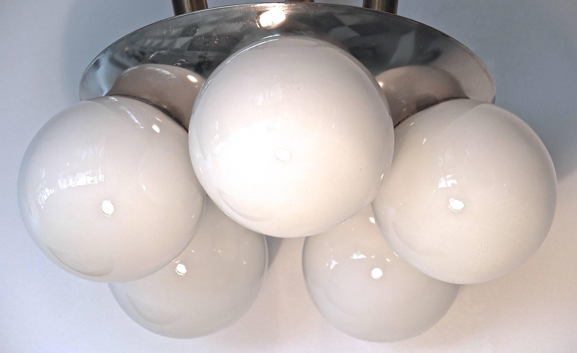 Pair of 1960s flush mounted ceiling lights with chromed dome fixture with five gloss white glass globes each of which are illuminated by a single Edison screw cap bulb up to 60 watts each. Each globe is 5.75