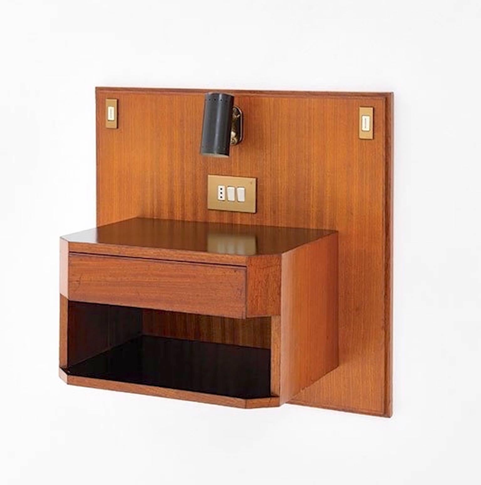 Ico Parisi hanging nightstand.

Designed for hotel Lorena, Grosseto in 1961.

Produced by Bernini.

The adjustable lamp was produced by the firm Greco.

Features one drawer above a storage compartment.

Literature: Domus 1960-1964, Volume