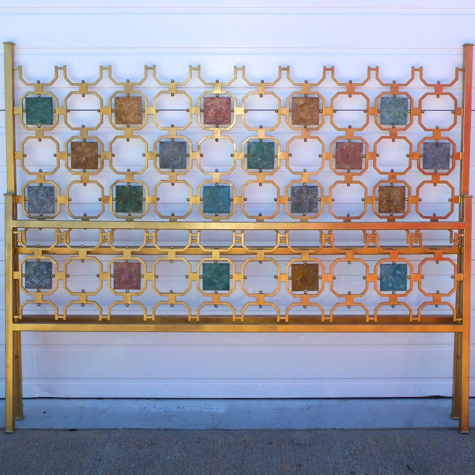 This is a 1950s, Italian bed (headboard and footboard) made in the style of the bronze beds by Arnaldo Pomodoro for Arredamento Borsani.

This bed is made of gilt iron and the ornaments are textured and colored metal squares.

Protruding from