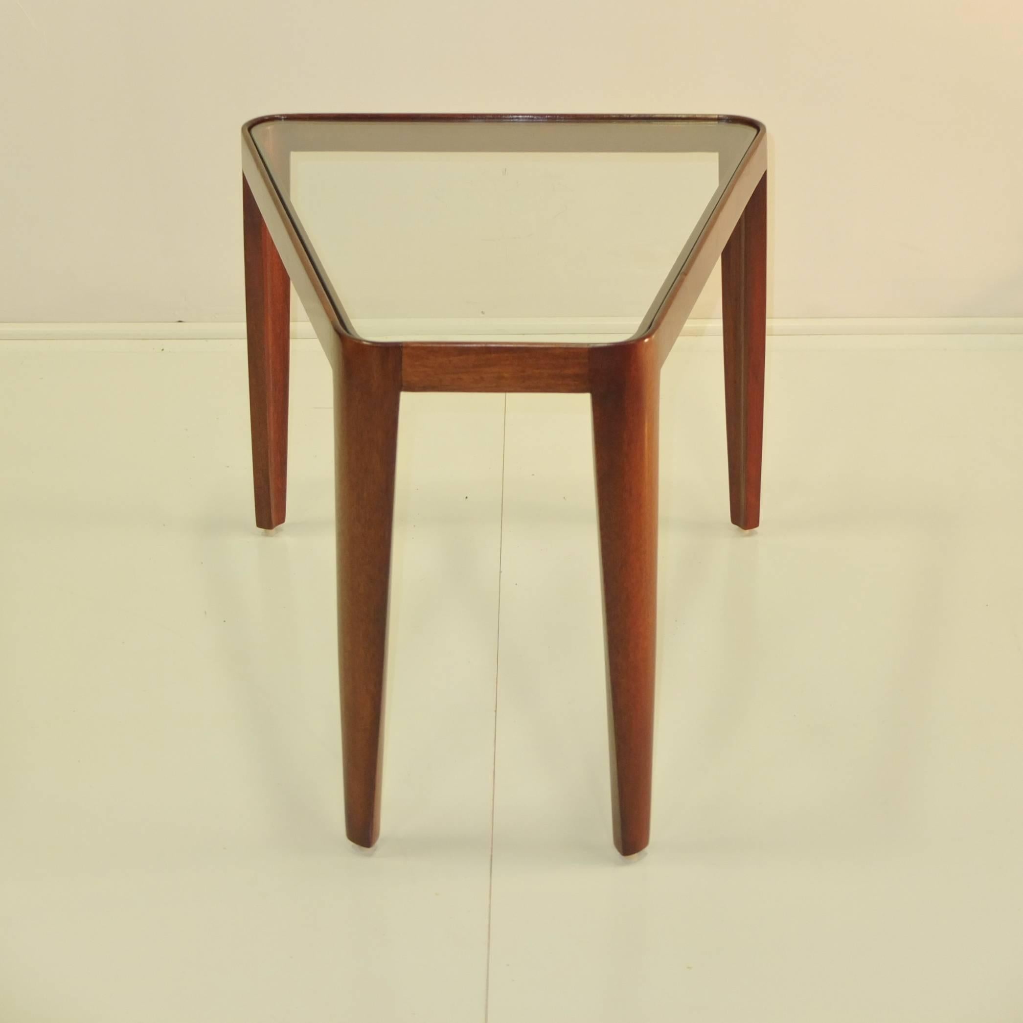 Wedge shape side table in mahogany with glass top by Edward Wormley for Dunbar, 1948. Model number 4809.