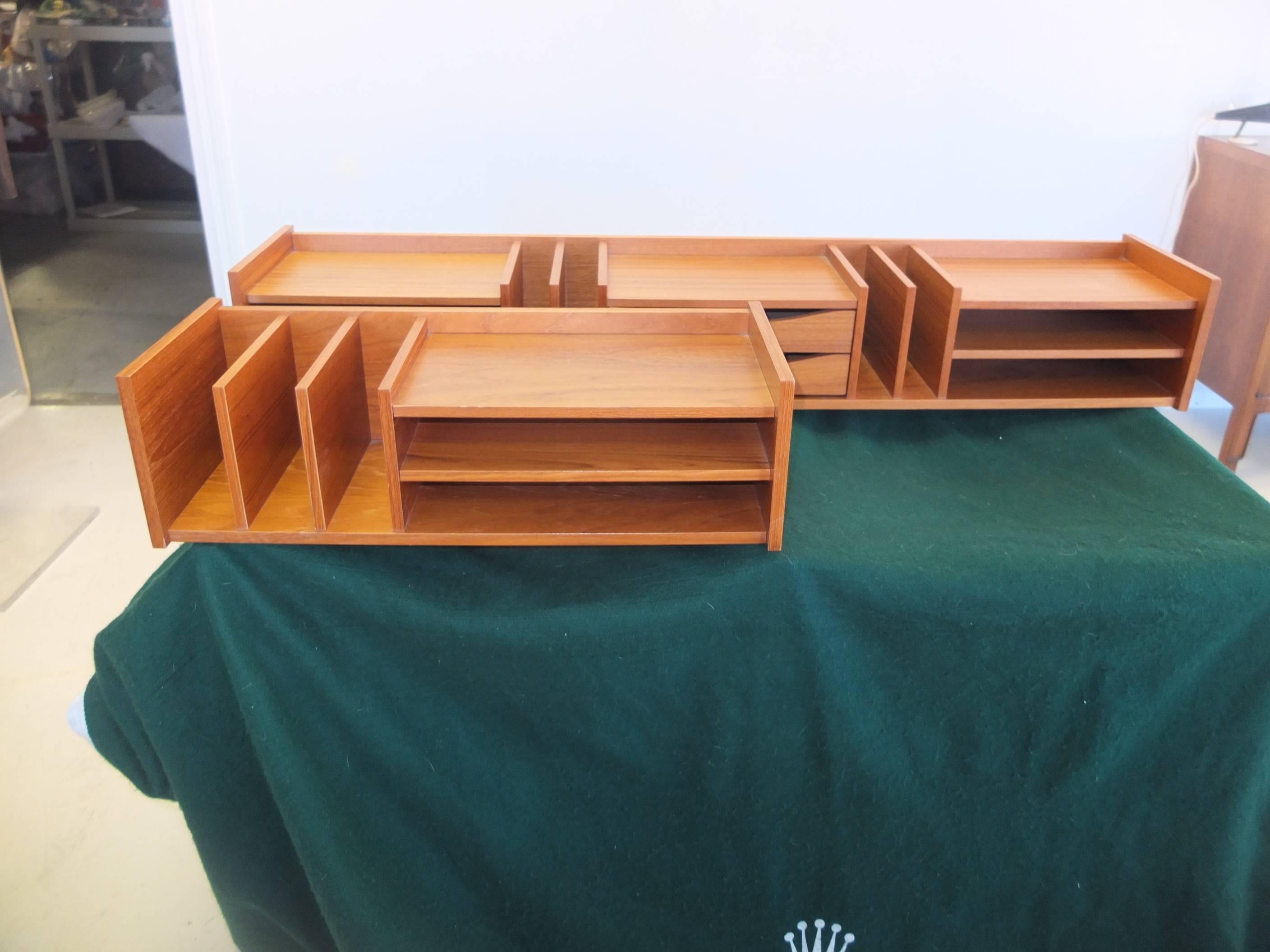 Part of the SelectForm series by Georg Petersen Mobilfabrik of Denmark, two separate teak desktop organizers with flat file sections, drawers and vertical file sections. Beautiful wood grain and easily moveable.

Price shown is for both