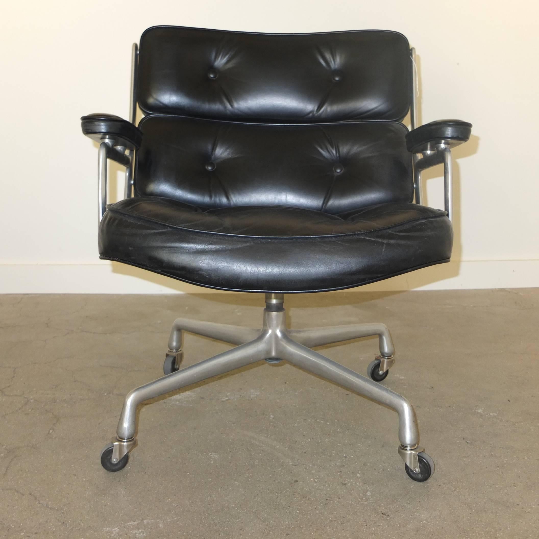Original 1960s model of Eames' Lobby chair for the Time Life building designed by Herman Miller. Original black leather has been cleaned and conditioned by Hub Leather. Early wheels without fenders (can be removed if preferred). This is the shorter